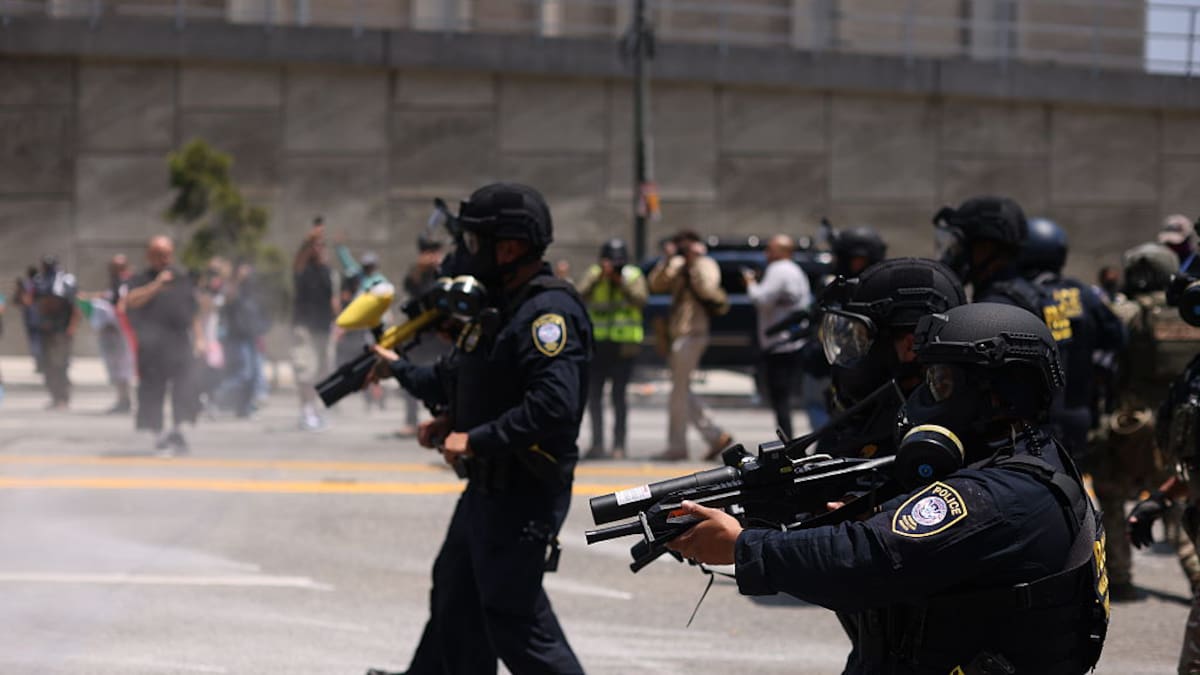 Tear gas fired at protesters in Los Angeles as Donald Trump warns of ‘troops everywhere’