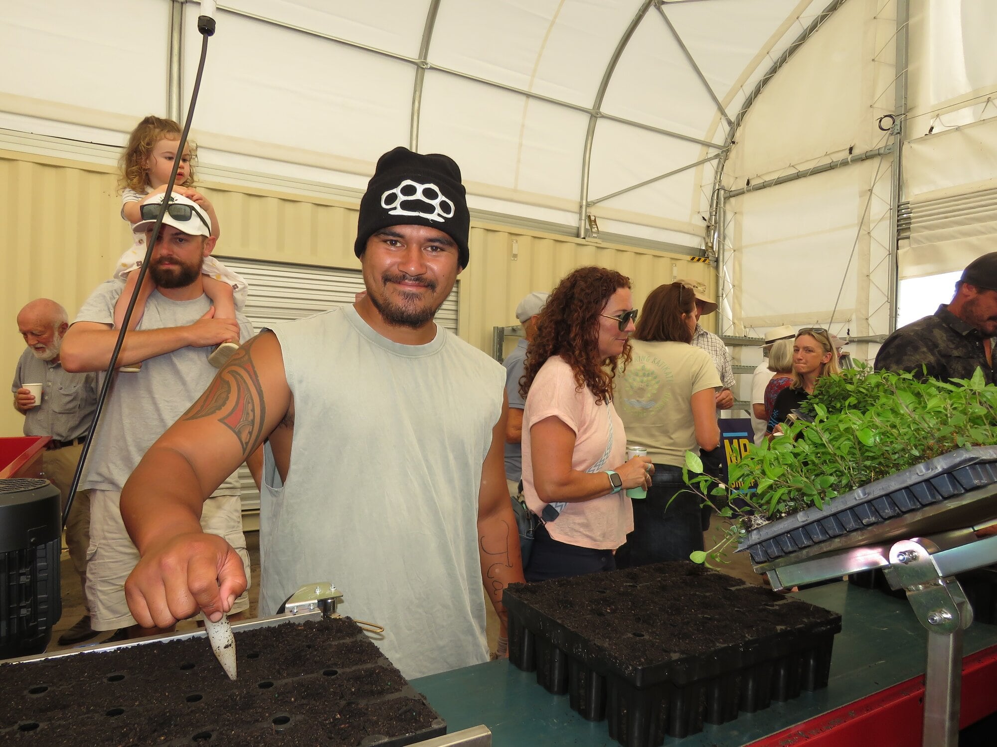  REP Crew Team Leader TeJay Samuels with the new tray filling machine. Photo / Merle Cave