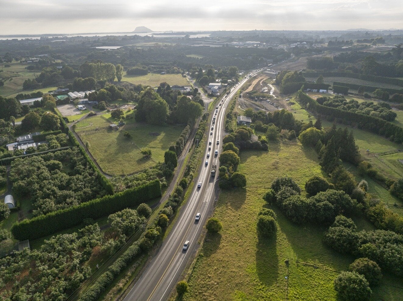 The existing State Highway 2 looking towards Te Puna, with Mauao, Mount Maunganui in the distance. Photo / NZTA