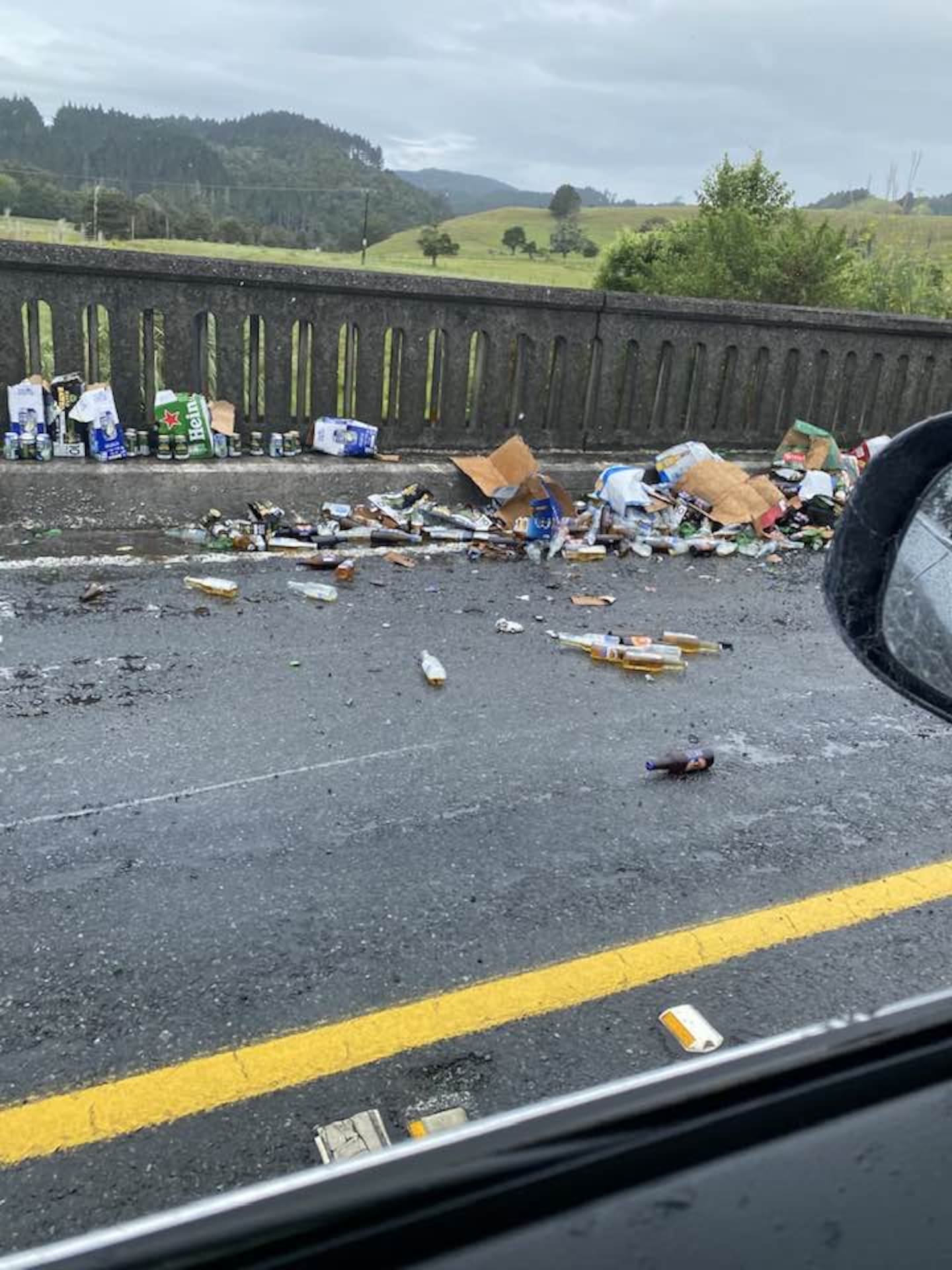 The van rolled on to its side, spilling liquor and glass over Riverside Drive. Photo / Dr Shane Reti