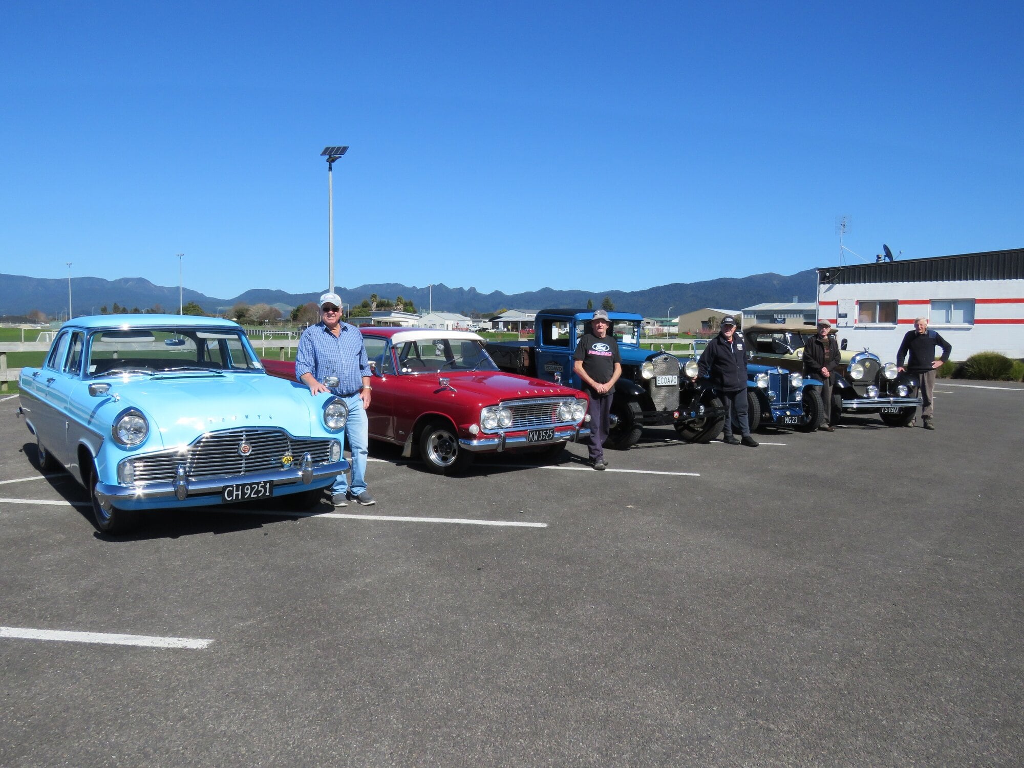  Driver Peter Adams with Tony Hall, Doug Brown, Peter Lawn and Murray Tom and their vehicles, ready for Saturday’s parade. Photo / Merle Cave