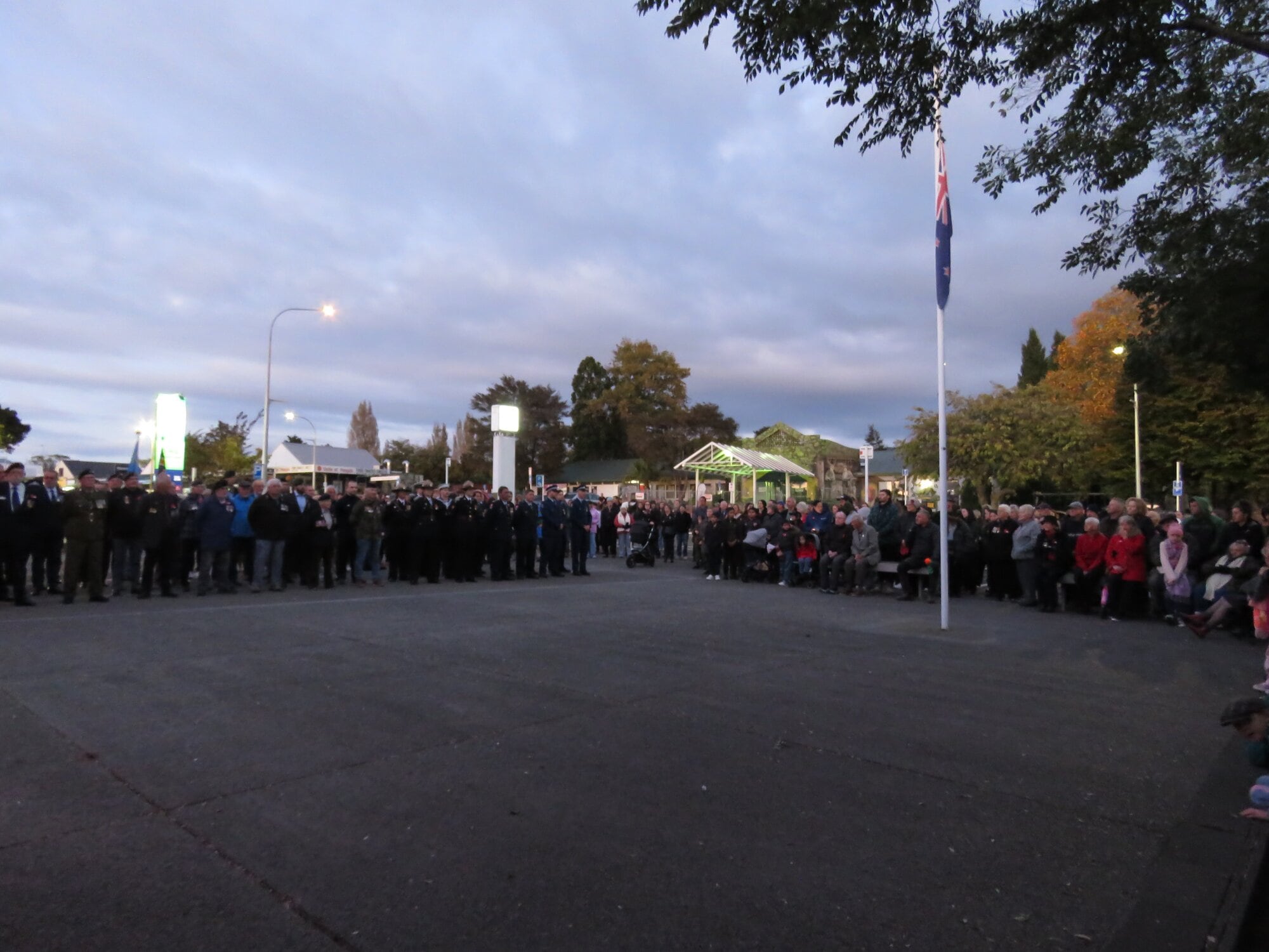  Returned servicemen stand to attention with representatives from police, fire and a number of other service organisations. Photo / Merle Cave