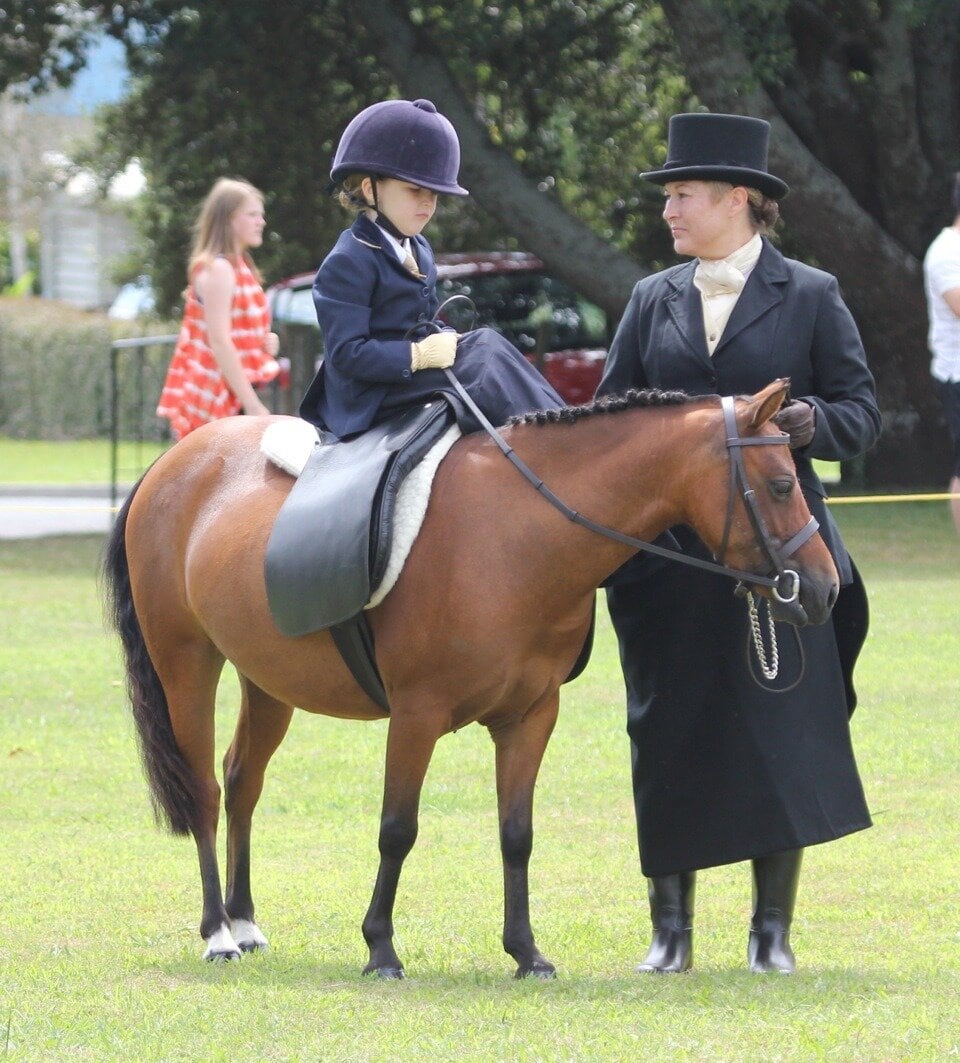 Katikati's Kate Downes, 4 with mum Liz Ward who led her in the Lead Rein Junior Side Saddle demonstration events, a first for New Zealand, at the Katikati A&P Society 90th Annual Show held on Sunday, February 5 at the Uretara Domain.
CREDIT: CAROL DARLING PHOTOGRAPHY
KTA 16Feb12 - kk080212sp5508 IN MINIATURE: Katikati's Kate Downes, 4, riding Charmarama, with mum Liz Ward, prepare for the demonstration. CREDIT: CAROL DARLING PHOTOGRAPHY Daughter Kate Downes, 4, riding Charmarama, with mum Liz Ward, prepare for the demonstration in 2012. Photo: Carol Darling Photography