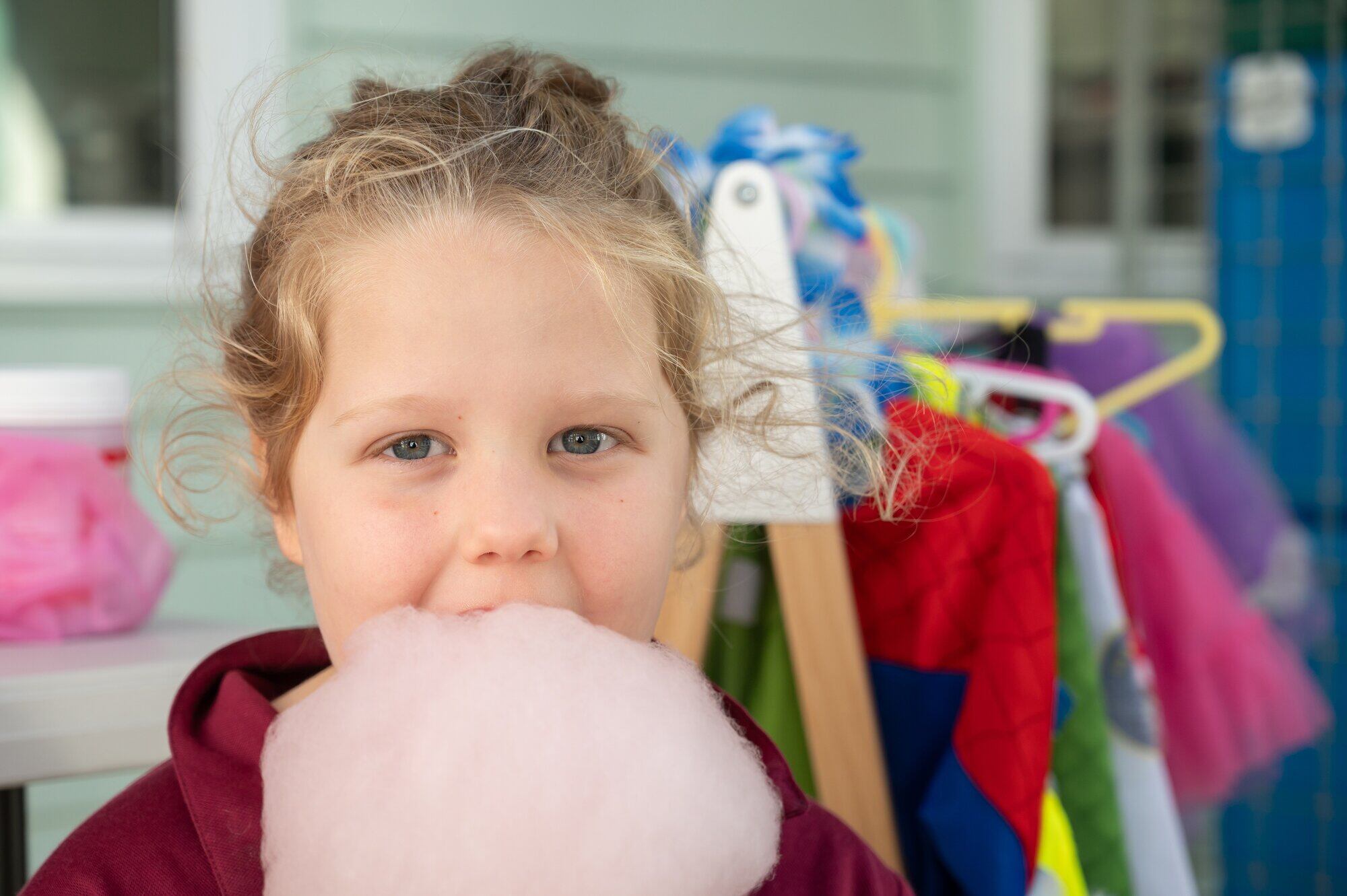 Greerton Village School pupil Autumn-Rose Carter, 5, on candy floss quality control duty for the school gala. Photo / Brydie Thompson.