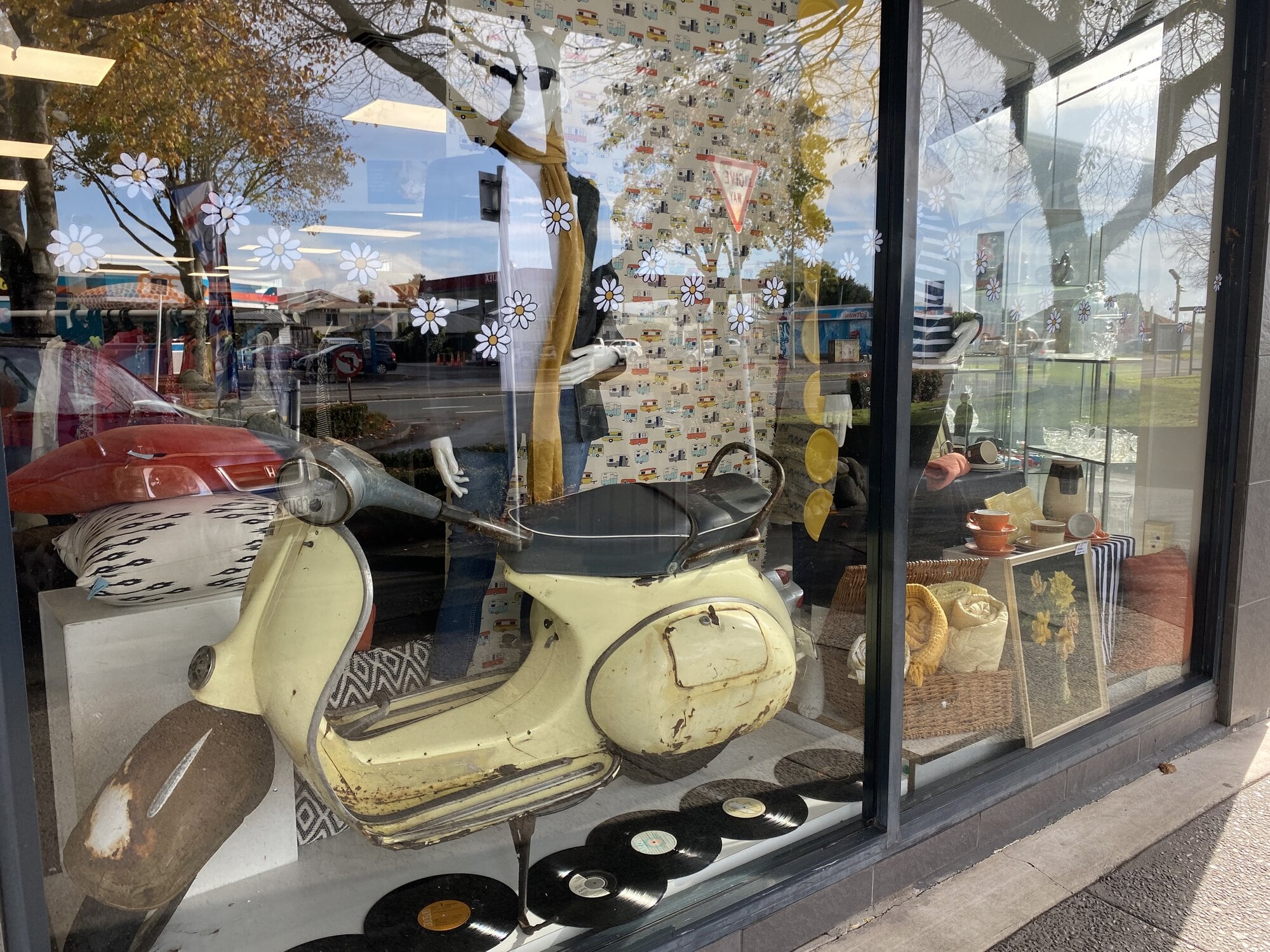 Waipuna Hospice Charity Shop’s window features a 1961 Vespa. Photo/Rosalie Liddle Crawford.