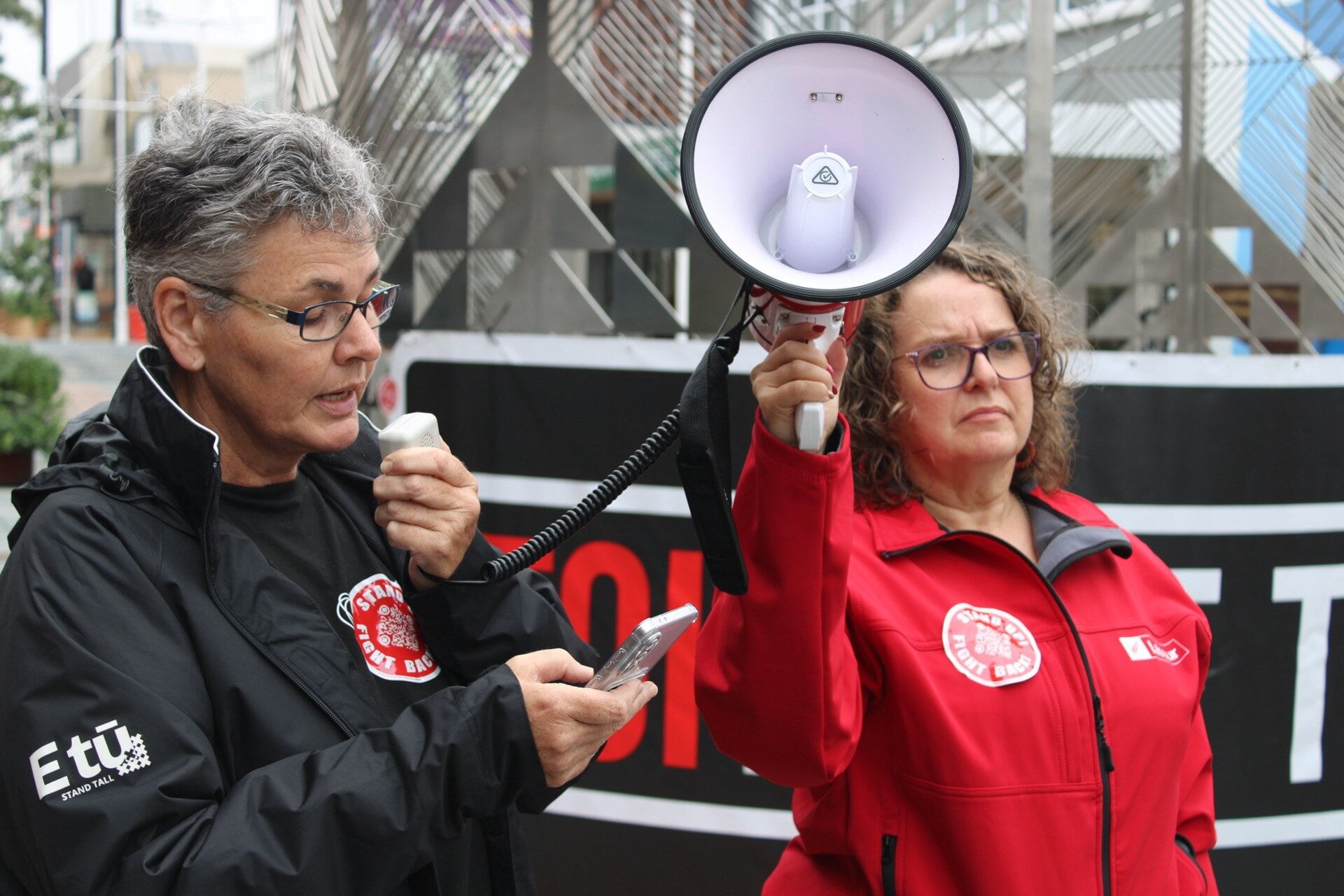 Local care and support worker of the E Tū union, Tanya Oomen (left), speaking at Tauranga's protest against the Equal Pay Act changes. Photo / Ayla Yeoman