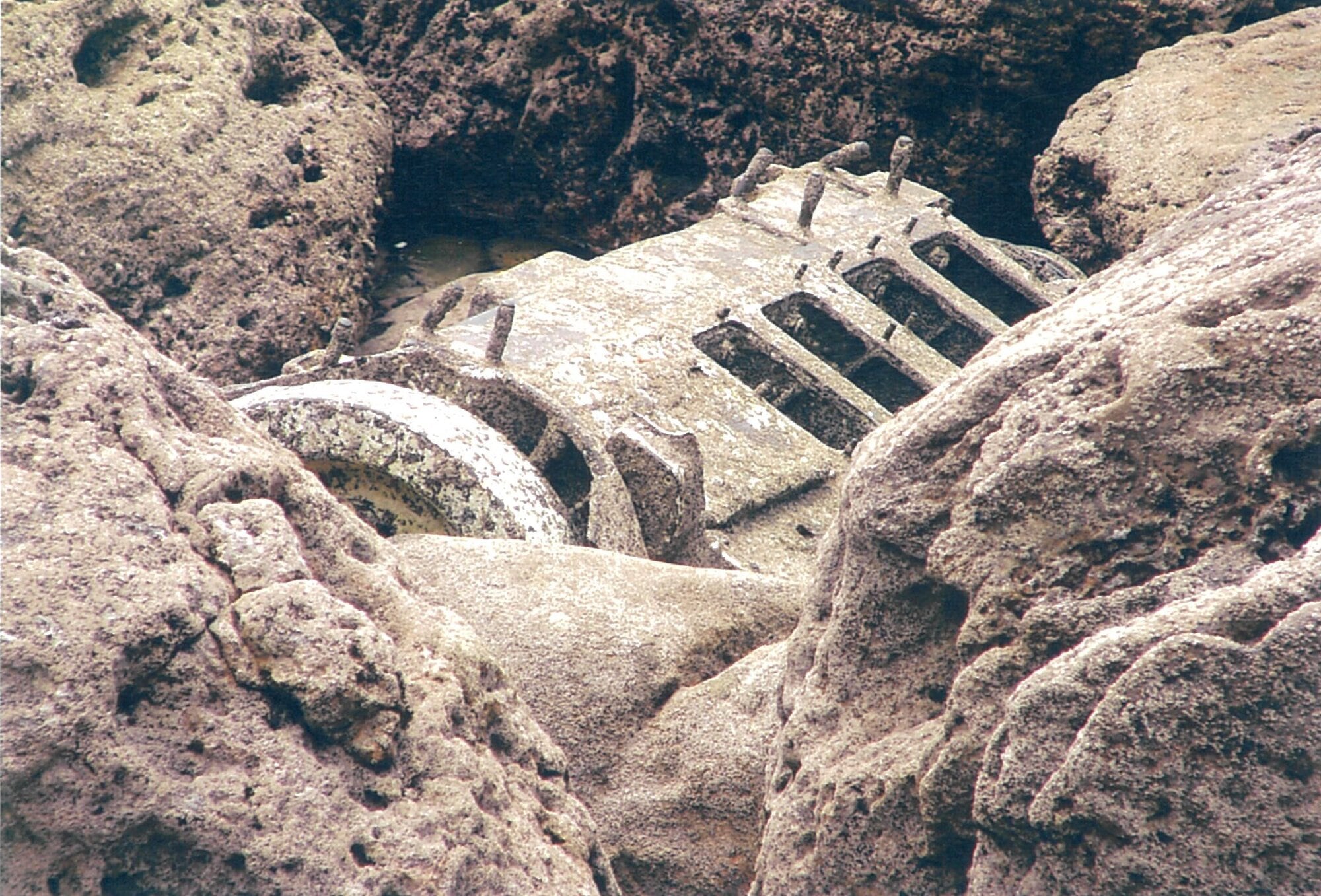 All that remains of the boat is this engine block which washed up on rocks at the foot of Mauao. Photo / Colleen Killeen