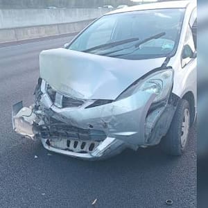 Auckland woman’s car written off after she swerves to avoid hay bale on Northwestern motorway