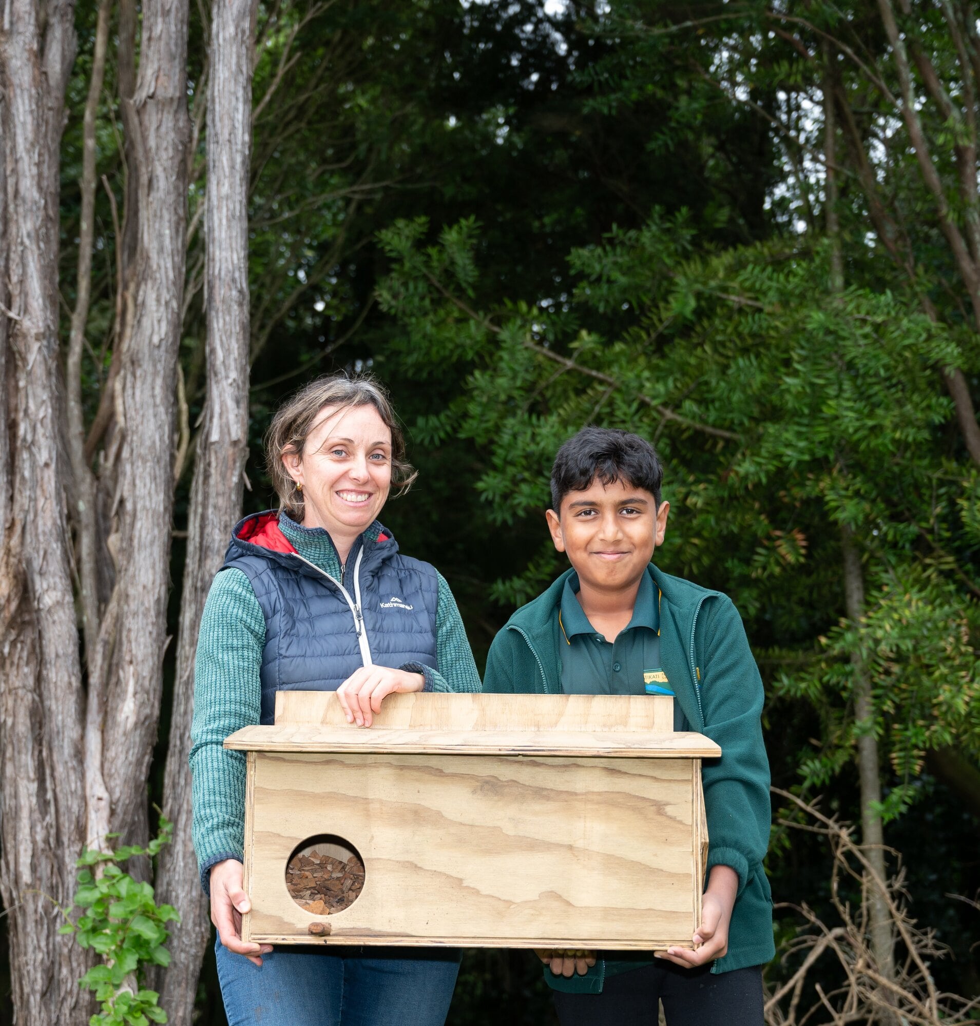 Tammy Bruce Treasuring Our Place environmental educator (funded through the museum) Myansh Patel 9  Pictured at Tuesday’s mucking-in lesson, and the installation of the ruru nesting box, is Treasuring Our Place environmental educator Tammy Bruce and Katikati Primary School Year 5 student Myansh Patel, 9 at Te Awaawa gully. Photo / Brydie Thompson