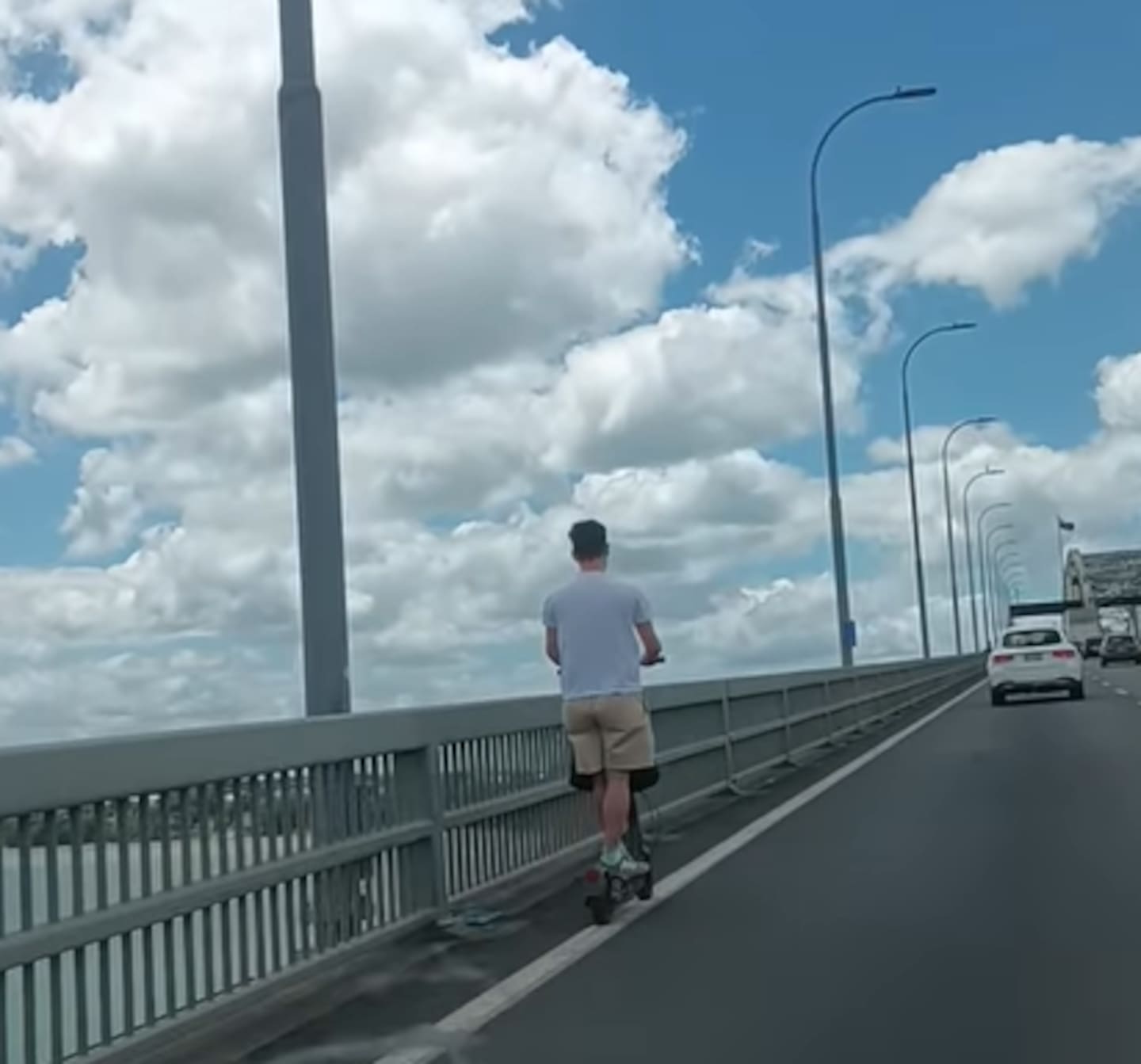 Footage shows the man travelling along the Auckland Harbour Bridge on an electric scooter. Photo / Tyke Sta