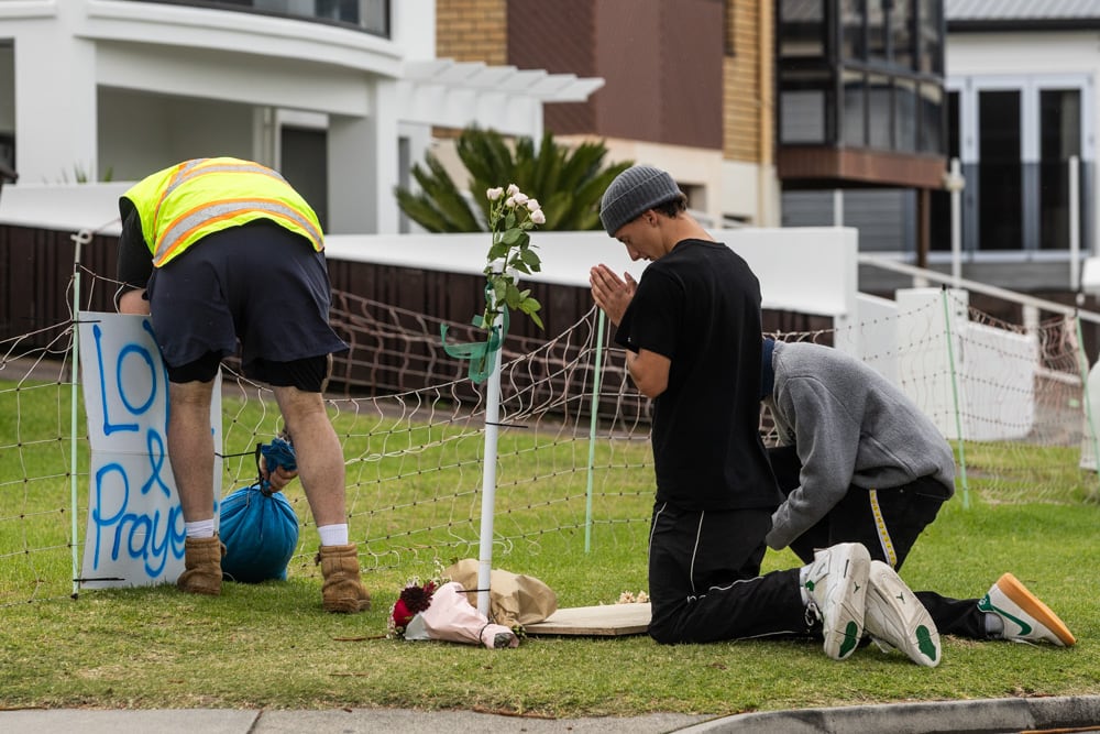 People paying their respects at the cordon and setting up a memorial on Saturday. Photo / Jason Dorday