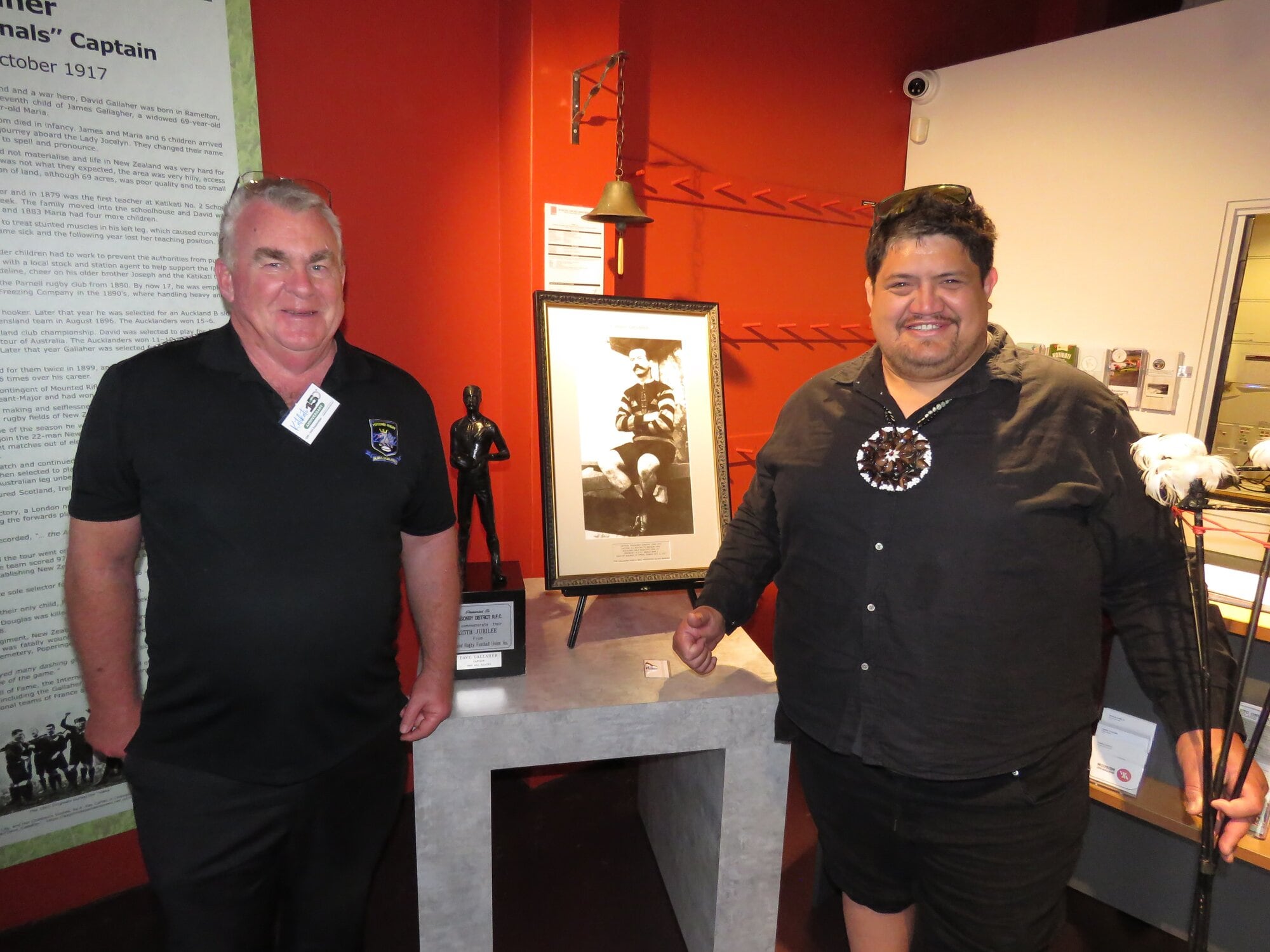  Ponsonby Rugby Club’s volunteer historian Paul Neazor with the Dave Gallaher memorabilia and Haimona Brown at Western Bay Museum. Photo / Merle Cave