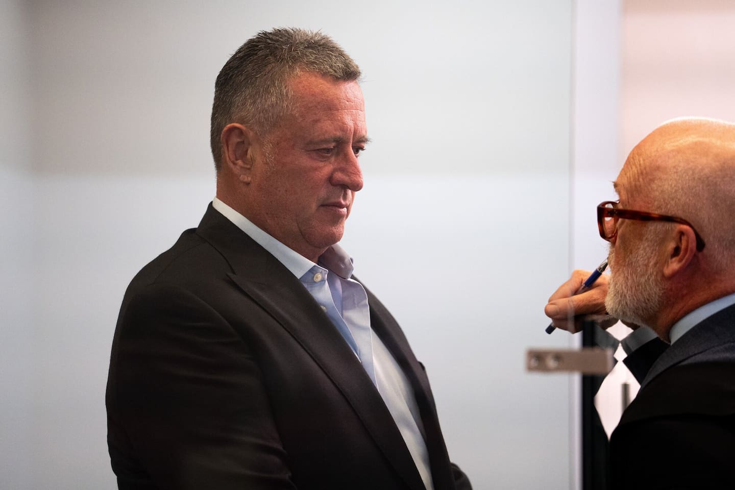 Andrew Montgomerie consults with defence lawyer Ron Mansfield, KC, at the start of his wounding trial in the Auckland District Court. Photo / Alyse Wright