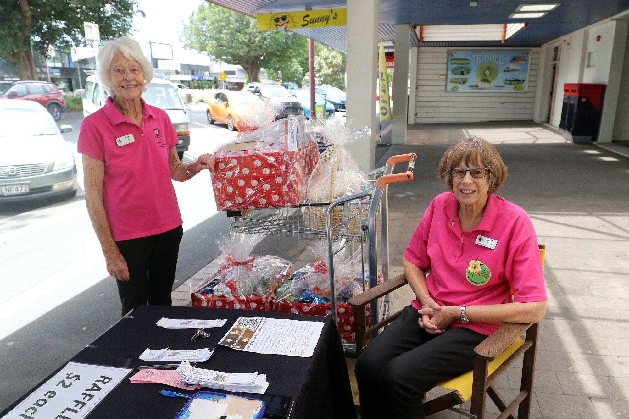  Joan Shand and Jean Green doing their bit on the raffle ticket table able outside Sunny’s.
Photo / Stuart Whitaker