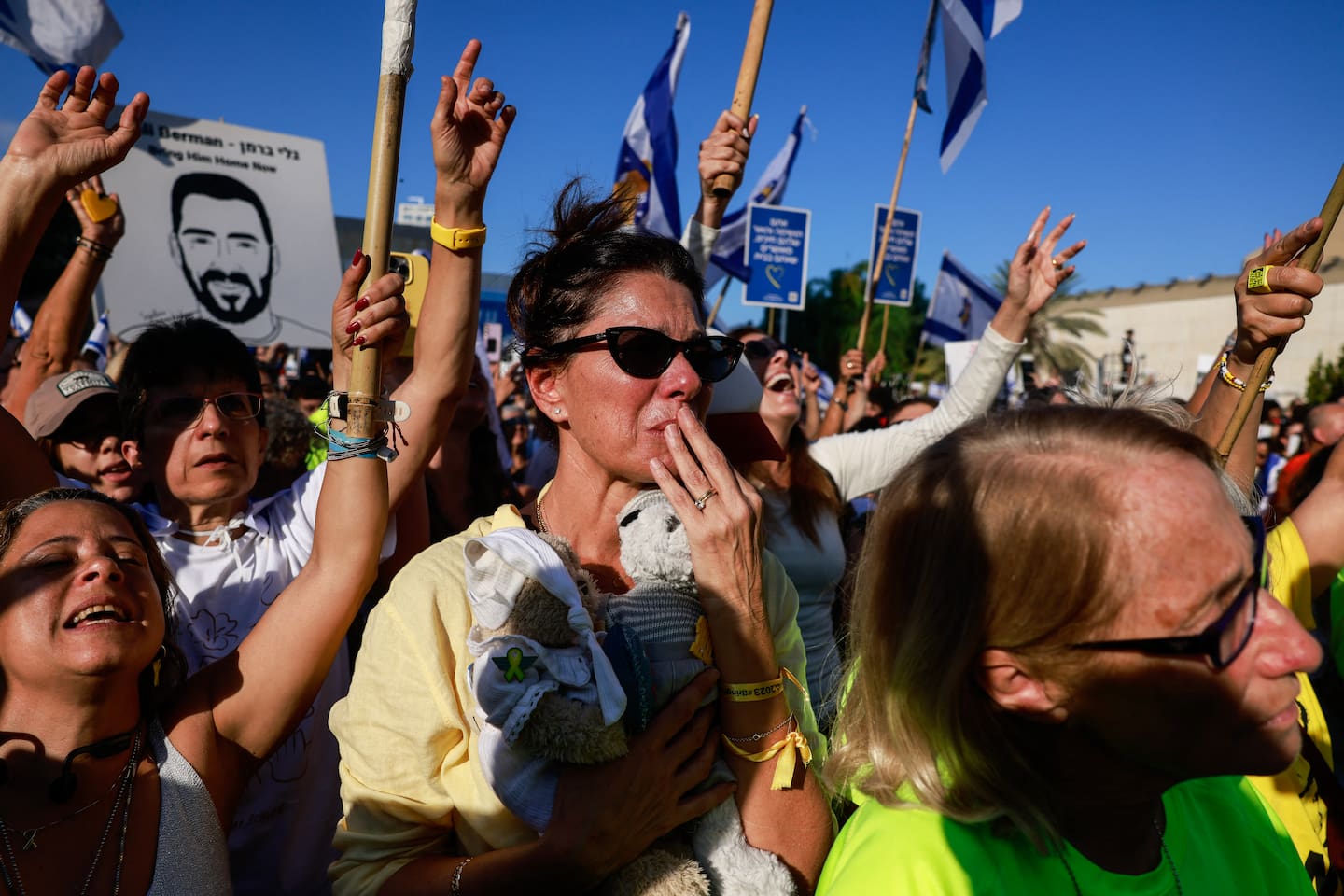A woman reacts as people celebrate at Hostage Square in Tel Aviv as news came out that Hamas has already handed over seven surviving hostages to the Red Cross on October 13, 2025. Photo / AFP, Menahem Kahana
