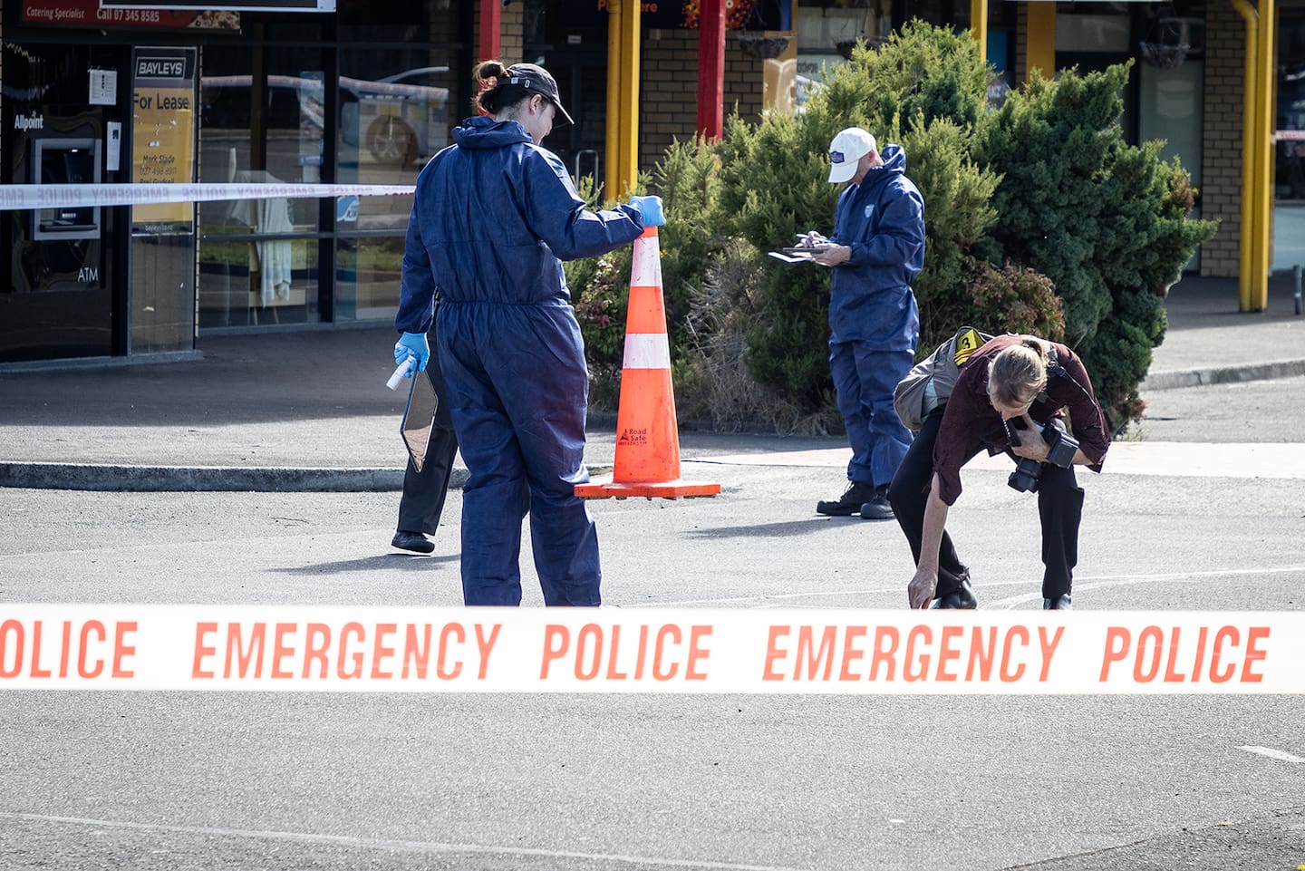 Police comb Te Ngae Shopping Centre in March looking for clues after a man was shot. Photo / Andrew Warner