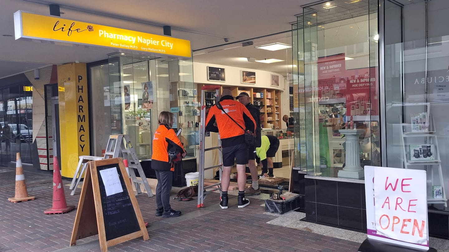 Contractors get to work on repairs at Life Pharmacy, Napier, after an early Monday morning burglary. Photo / Doug Laing