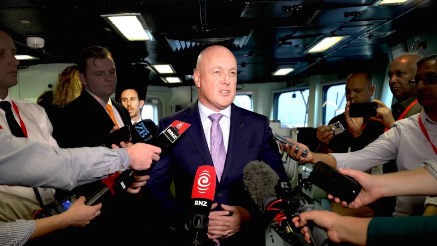 The Prime Minister's deputy chief press secretary (pictured back left), has resigned. Photo / Marika Khabazi, RNZ