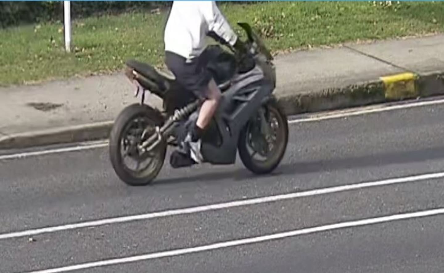 A CCTV image released by police of the motorcyclist they believe to be involved in the death of Paige Johnson. Photo / Supplied