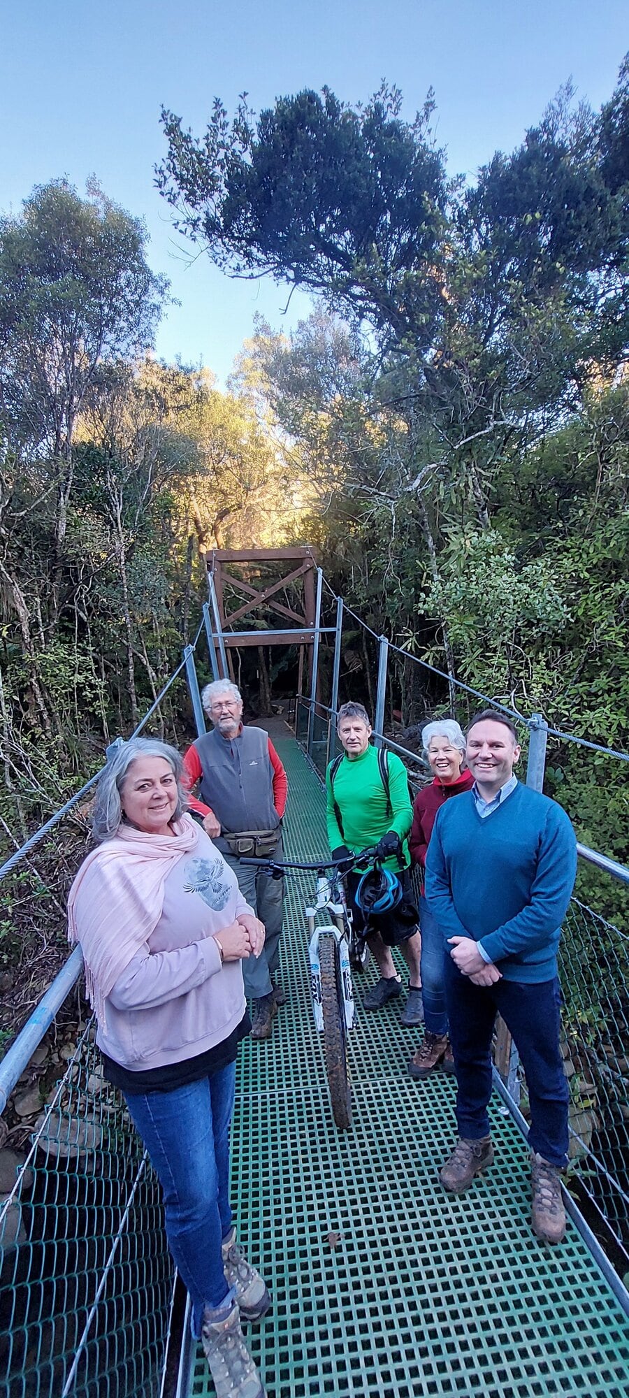  Katikati Recreational Park Development Group’s Jacqui Knight, Lawrie Macdonald and Damon McLachlan, Jill Jackson and Western Bay Mayor James Denyer on the new bridge. Photo / Supplied