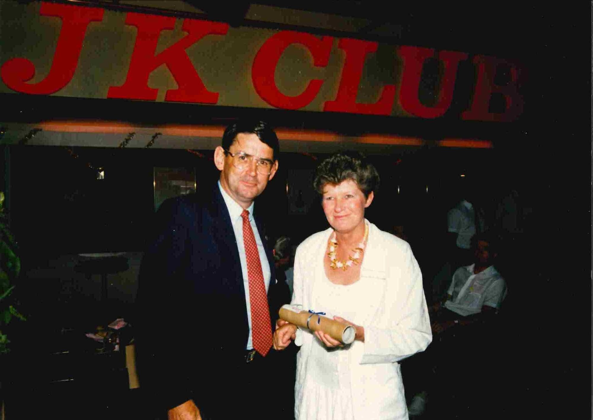  Rex Hadley, president of Waikato/Bay of Plenty district of the REINZ, hands Julene Foster her Associate Real Estate Licence in 1986. Photo / Supplied