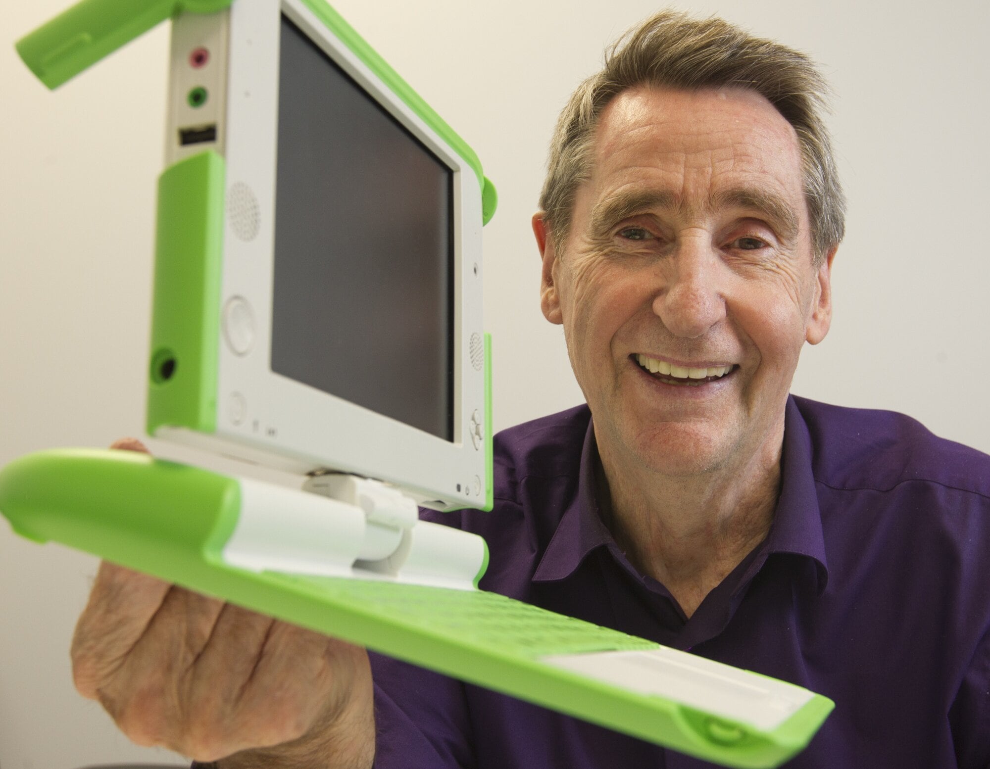 Professor Barry Vercoe, chief executive of One Laptop Per Child, pictured in Tauranga in 2013 with the XO laptop which he helped design. Professor Vercoe wanted to see the computers rolled out in New Zealand schools. Photo / Alan Gibson
