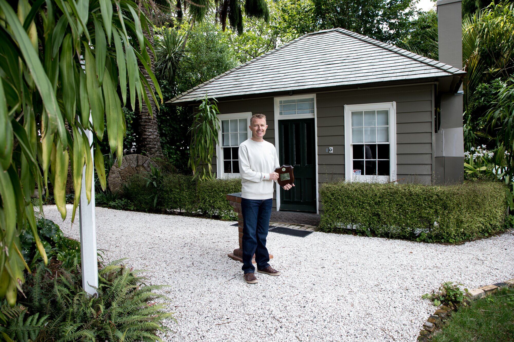  The Elms | Te Papa Tauranga manager Andrew Gregg outside the library in the same spot that Duff Maxwell - the inaugural recipient of the Tauranga Heritage Award &ndash; was photographed in 1983. Photo:  Jo Jones