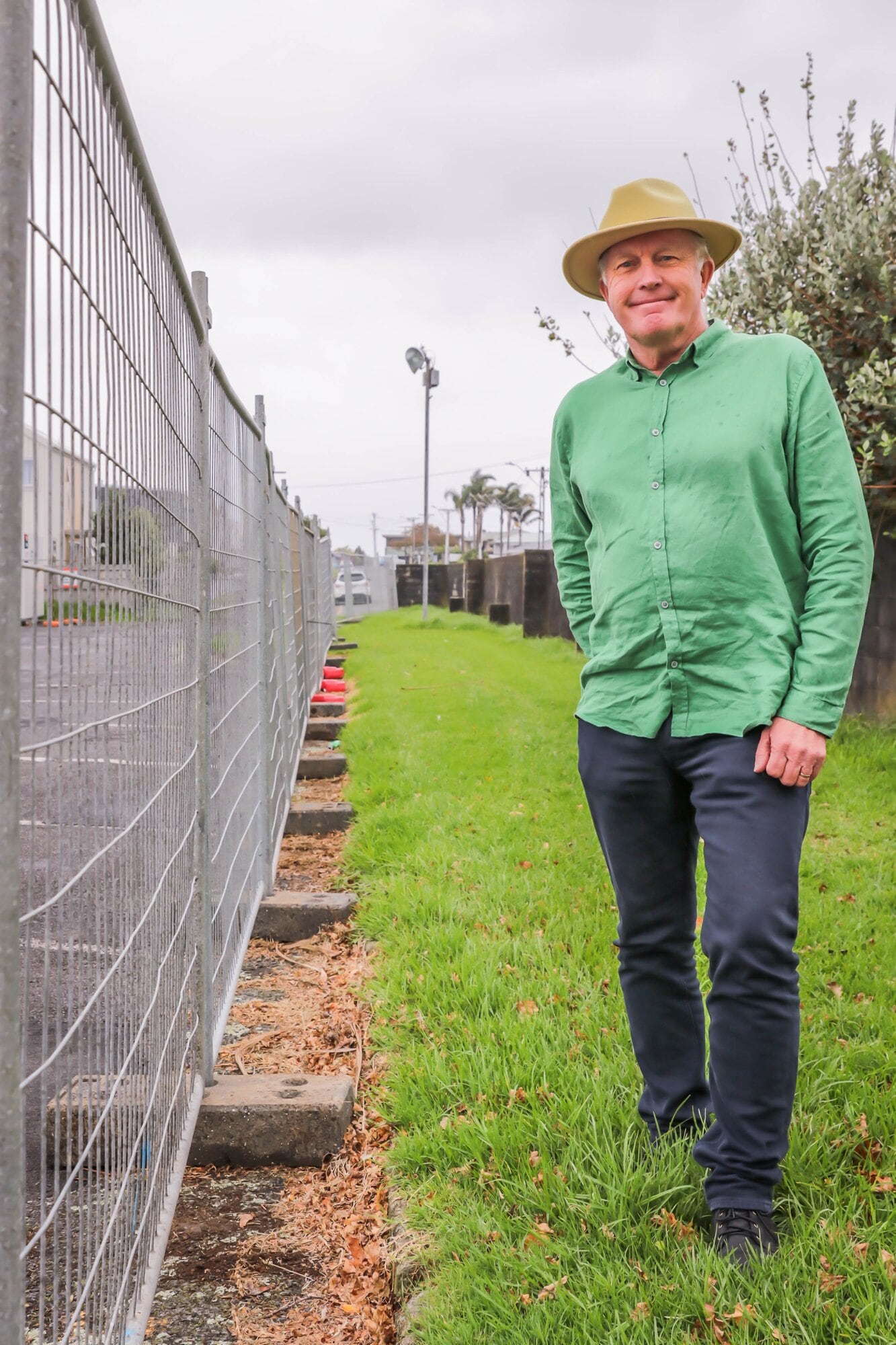 Tauranga City councillor Rod Taylor at the council-owned grassed area behind the carpark. About two metres at the far end is privately owned. Photo / Kelly O'Hara