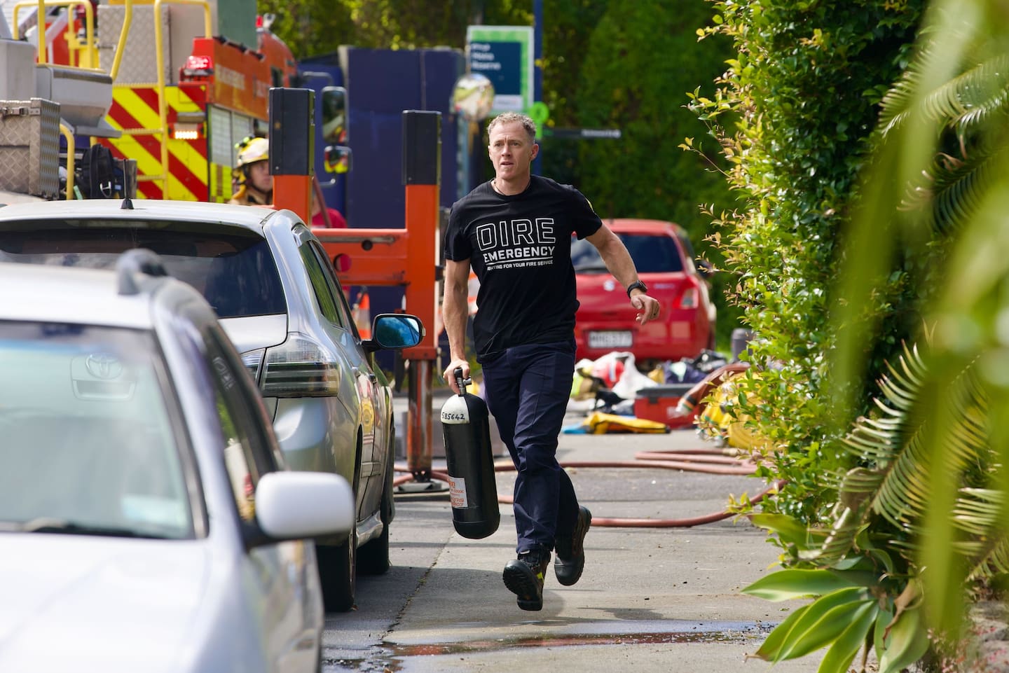 Firefighters at the scene of a house fire in Ponsonby. Photo / Jason Dorday
