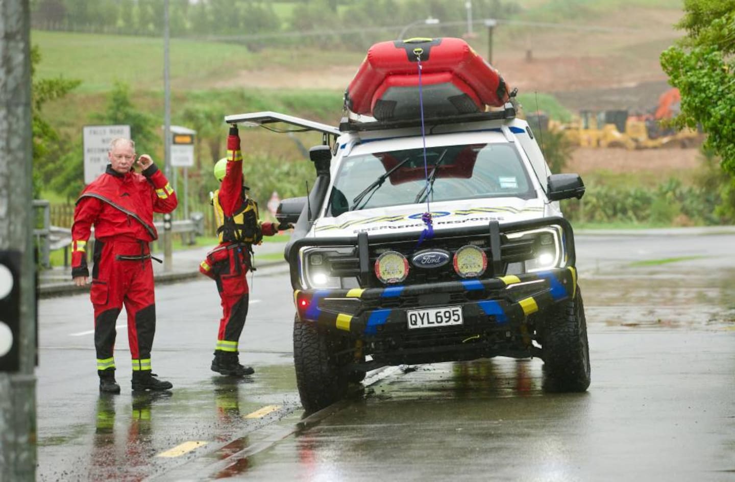 A search and rescue team near the intersection of Falls Rd and Mansel Dr, Warkworth, after a man and his vehicle were washed away on Wednesday morning. Photo / Jason Dorday