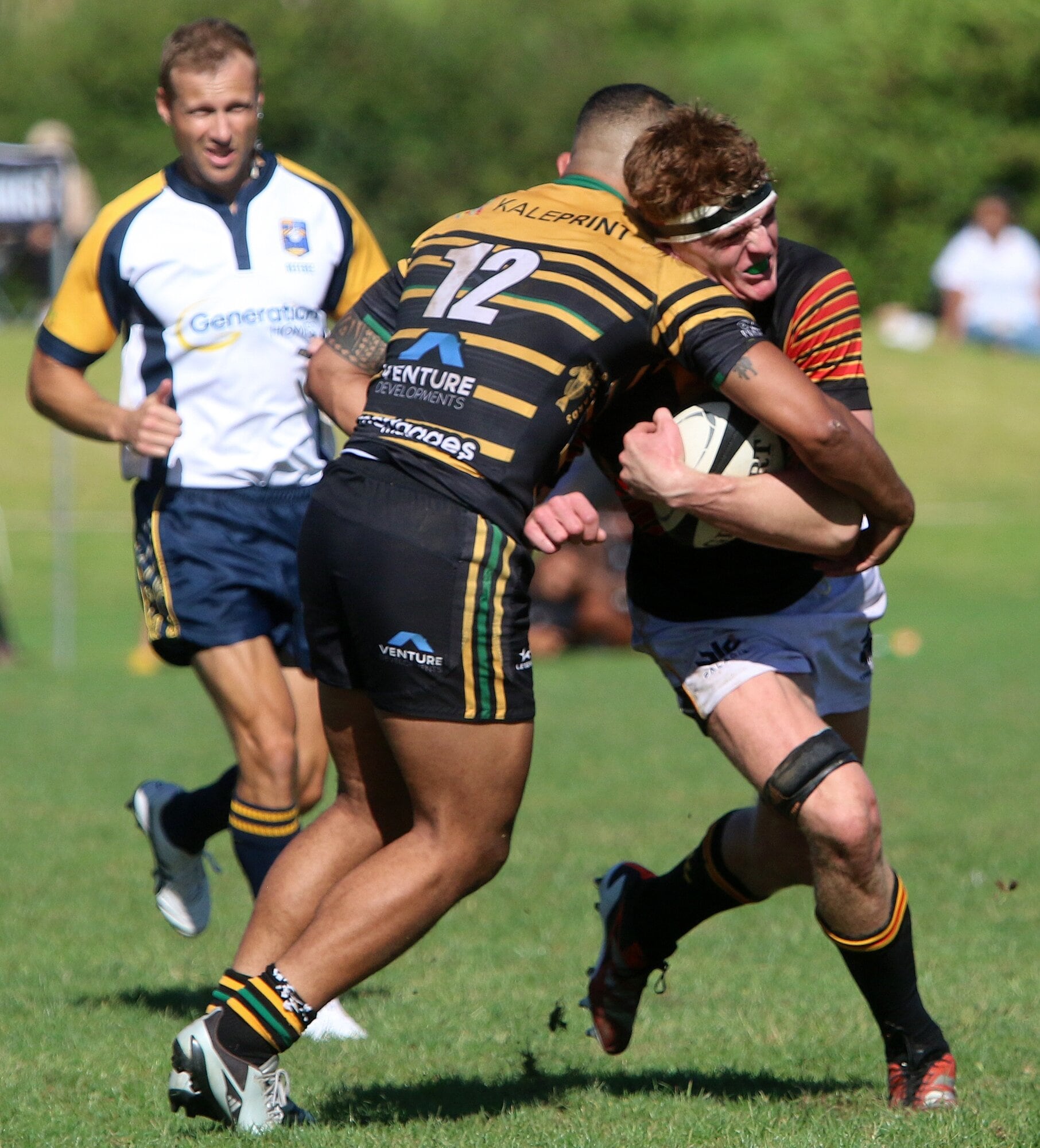 Kieran Harris takes a tackle. Photo / Stuart Whitaker