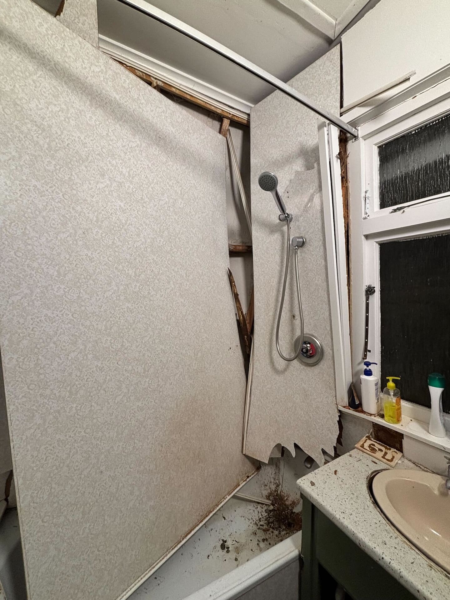 The bathroom in C.J. Koshar's flat had also been partially destroyed by the landslide. Photo / NZME