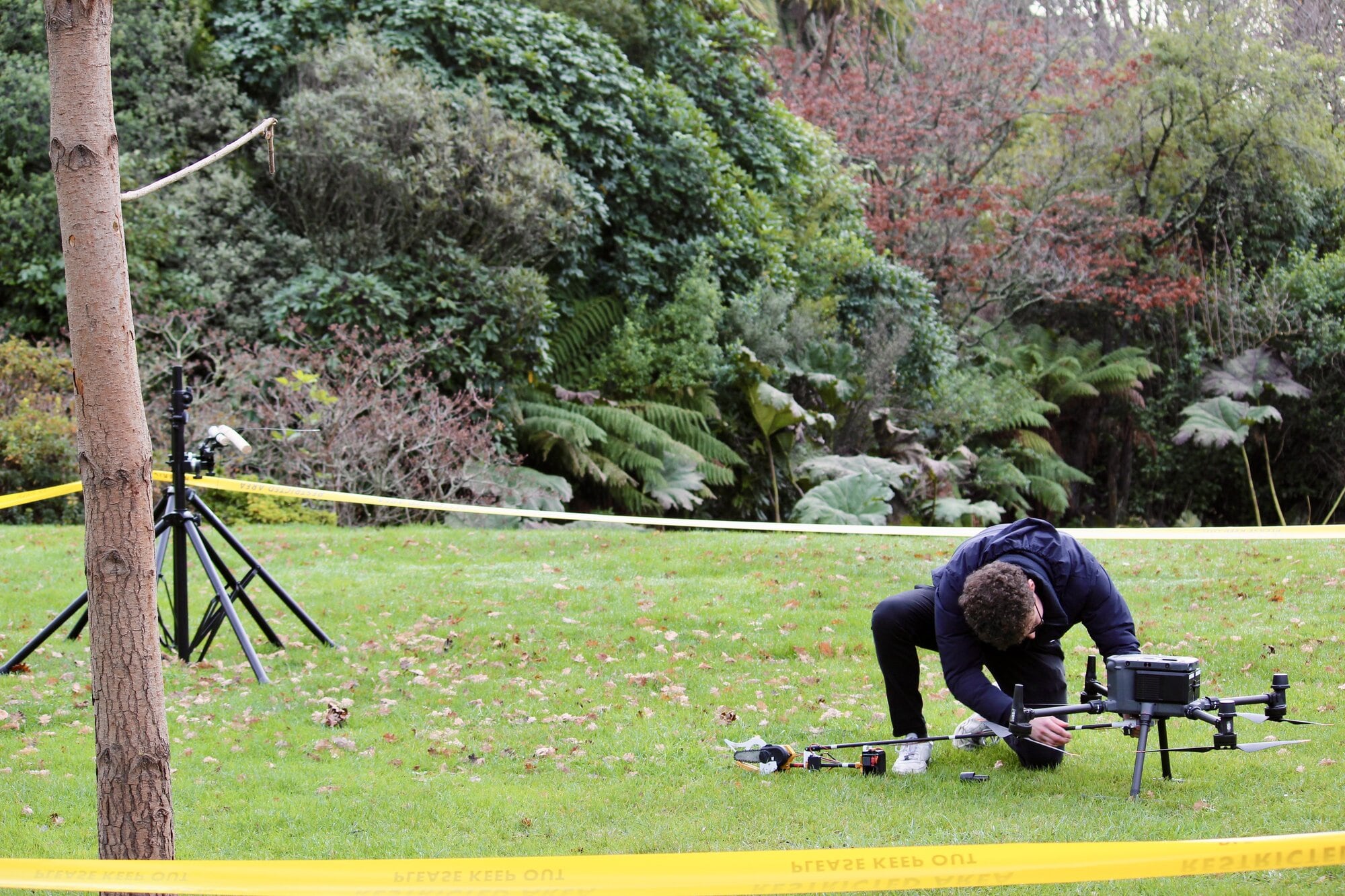 Adjusting the chainsaw drone during trials. Photo / Sacha Skinner, University of Canterbury