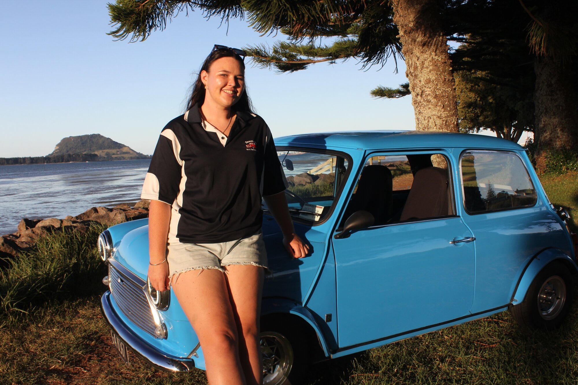  Paige Sutton with her 1972 Mini Morris. Photo / Debbie Griffiths