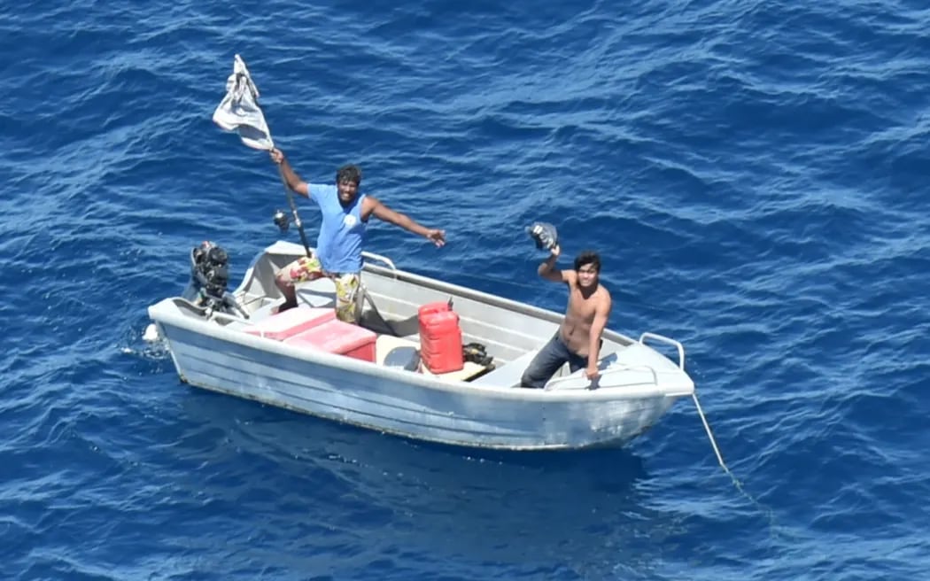 Kiribati fishermen signal to an NZDF Airforce Orion crew in 2022. Photo / NZDF