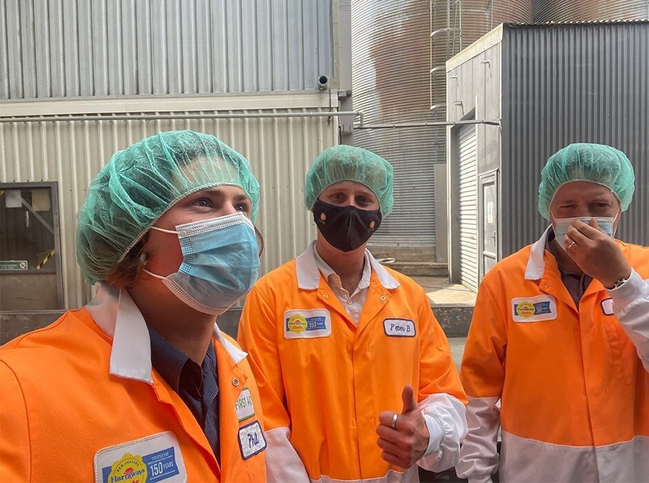  Bryn Fredheim, left, and Ryan Forlong, centre, taking a looking around the Harraways Oats site. Harraways Oats was one of their first clients. Photo / Supplied / University of Otago