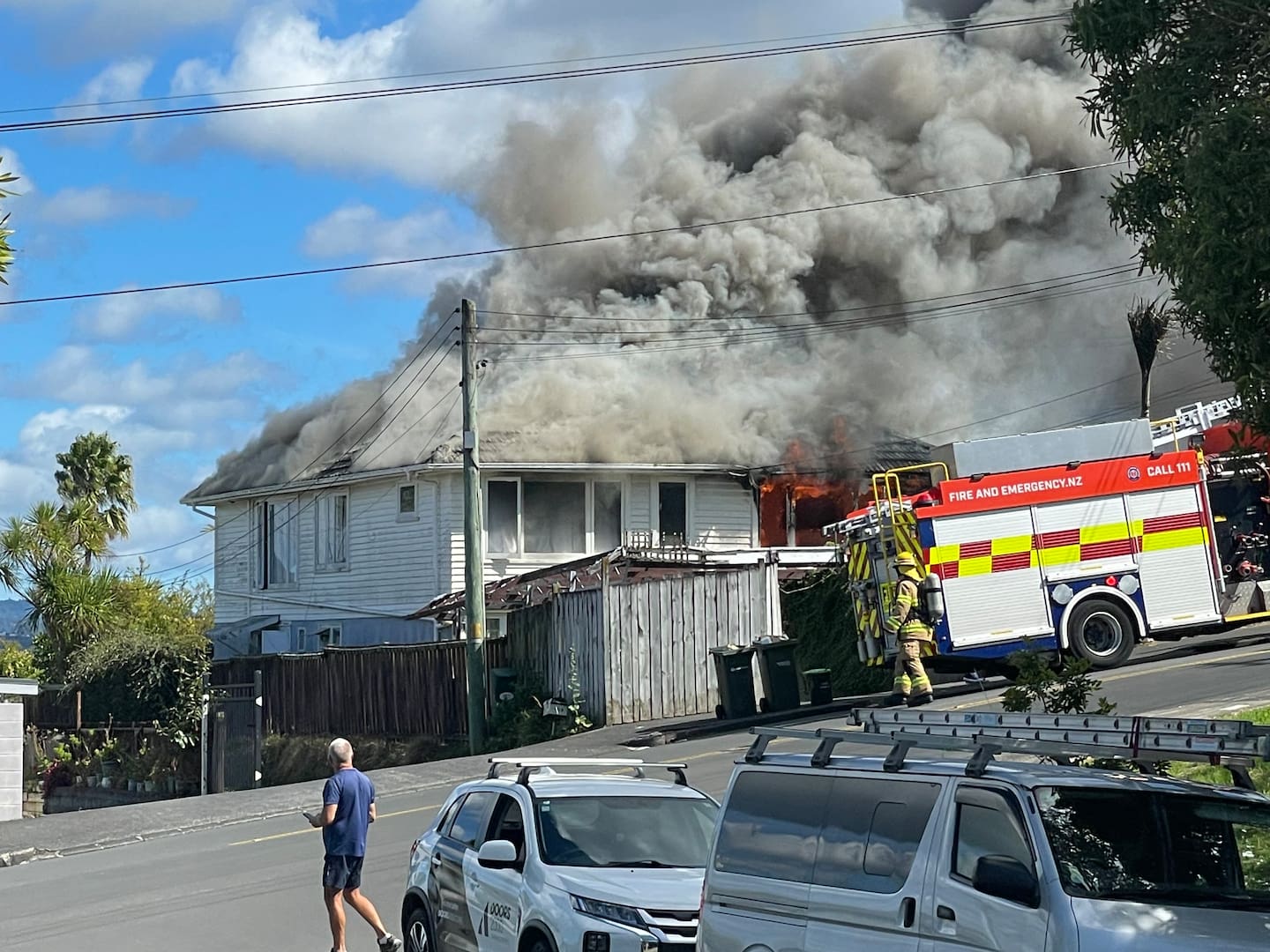Orange flames were visible from the inside, lapping through a window frame and burning the part of the guttering. Photo / Mark Roberts