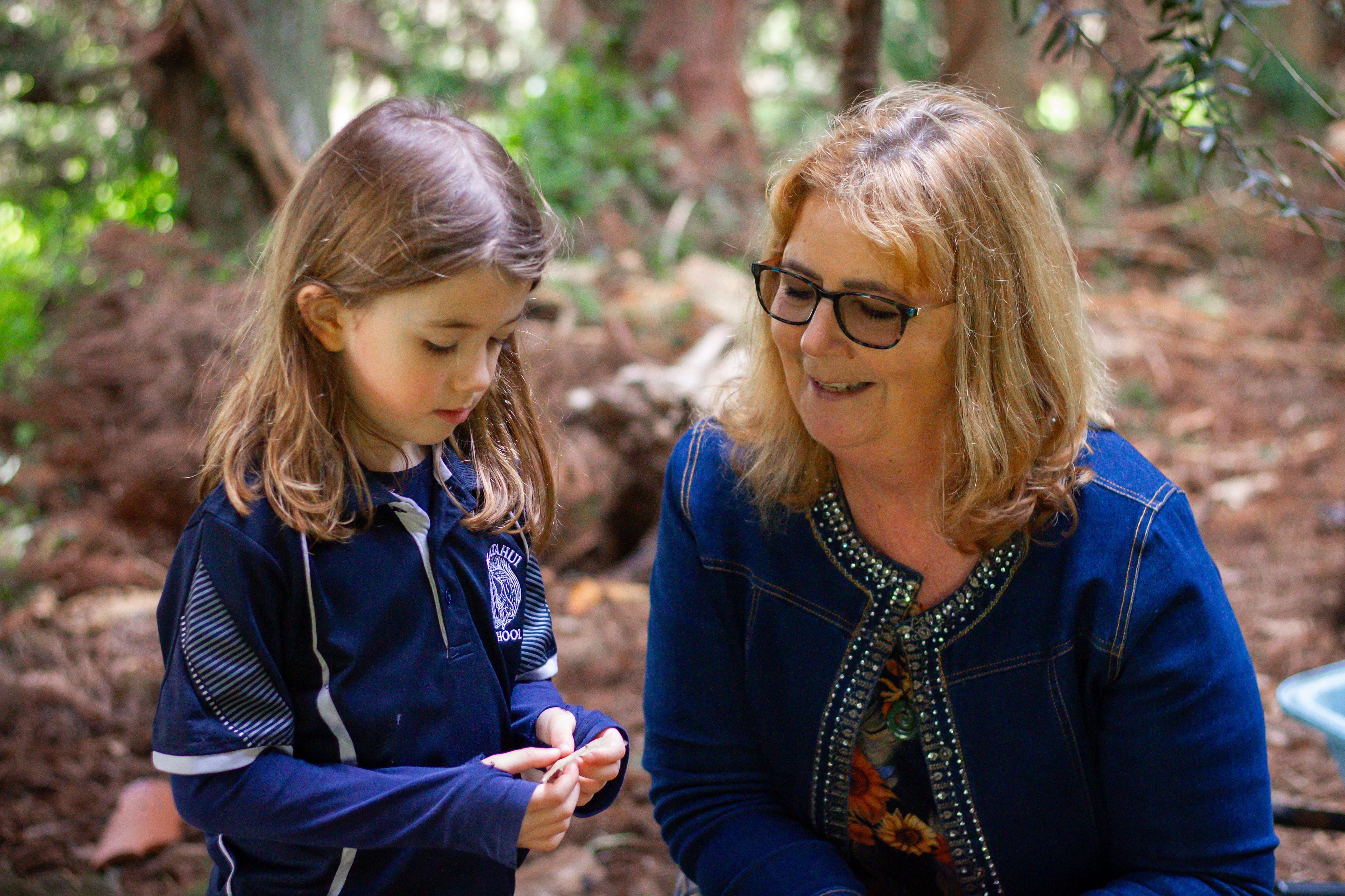 Principal Mary Woods with a Matahui School student at the guardians of the forest programme.