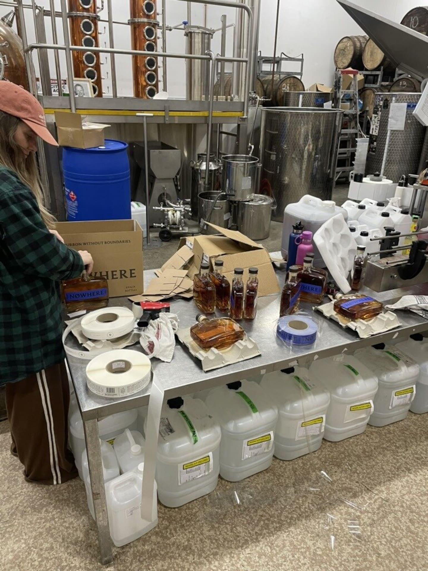 Nowhere Bourbon bottles being labelled during production in Napier.