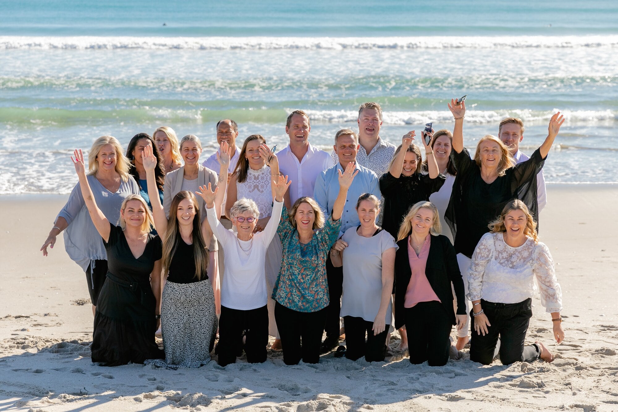  Julene Foster, third from left in front row, surrounded by her EVES Mount office colleagues today. Photo / Supplied