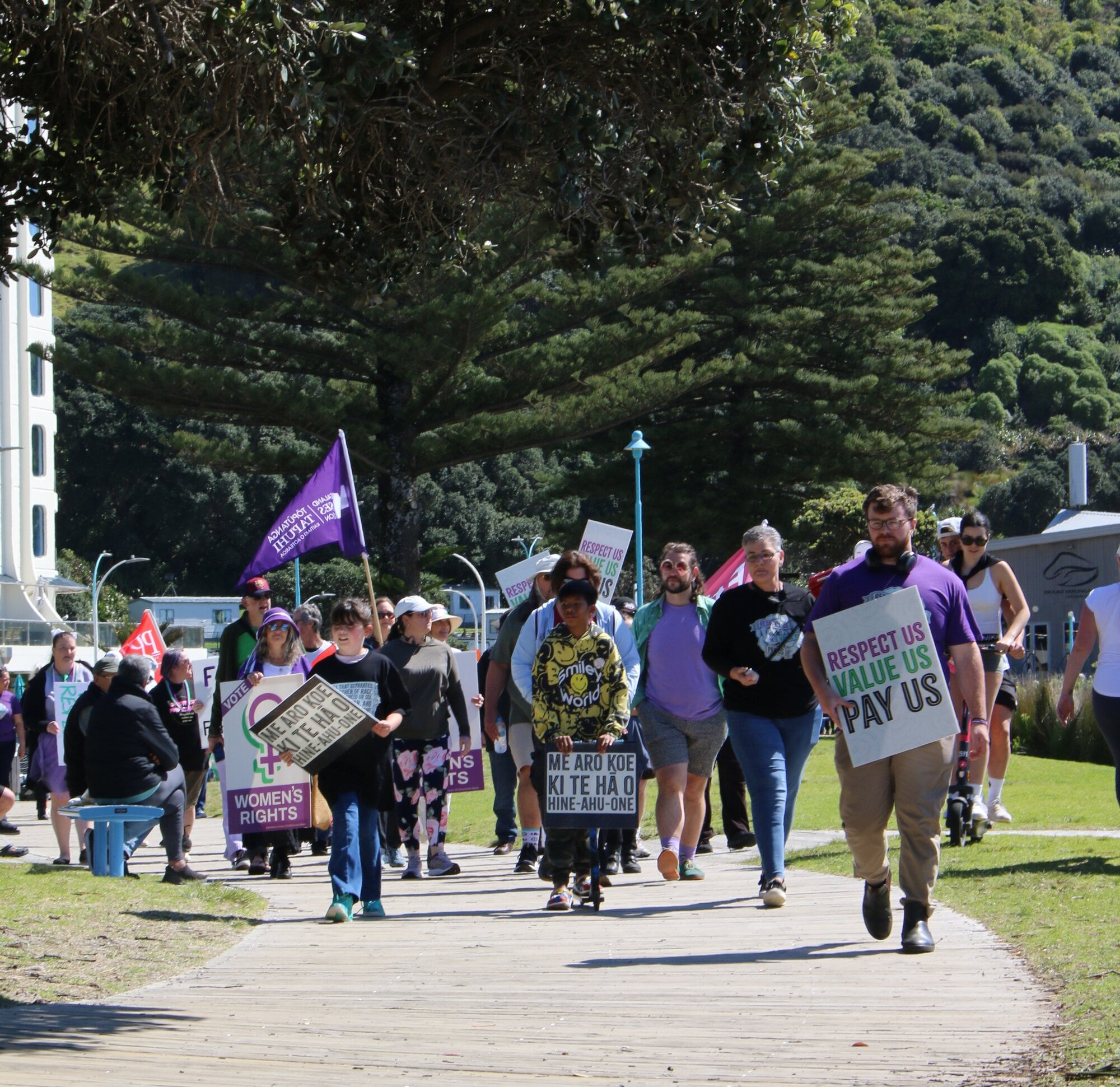 Protestors marching for pay equity along the boardwalk between Mount Drury and Mauao at Mount Maunganui on Saturday, September 20. Photo / Evie Thorne