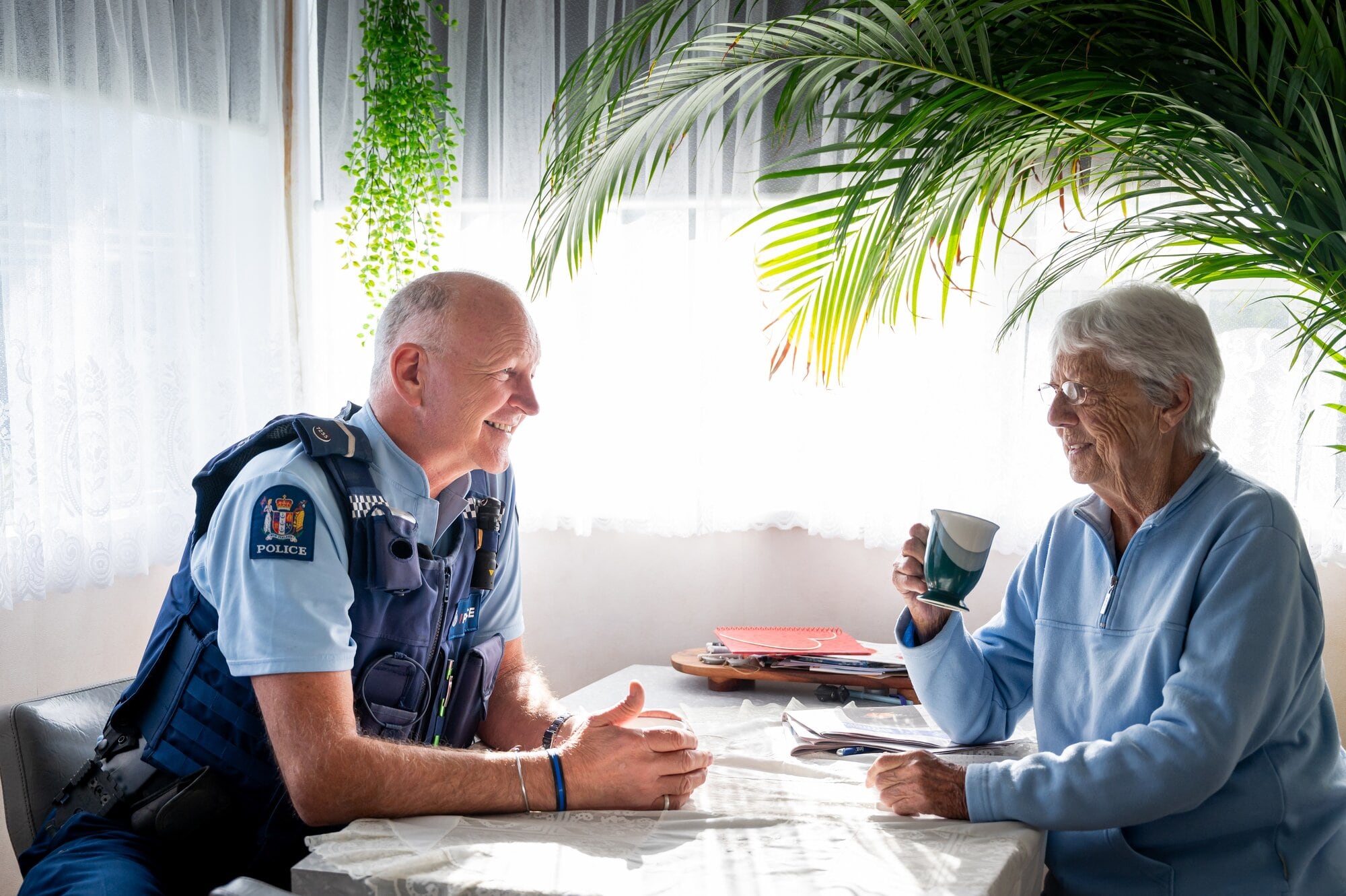 Adrian Oldham enjoys a cup of tea with Ailsa Scott. Photo / Brydie Thompson