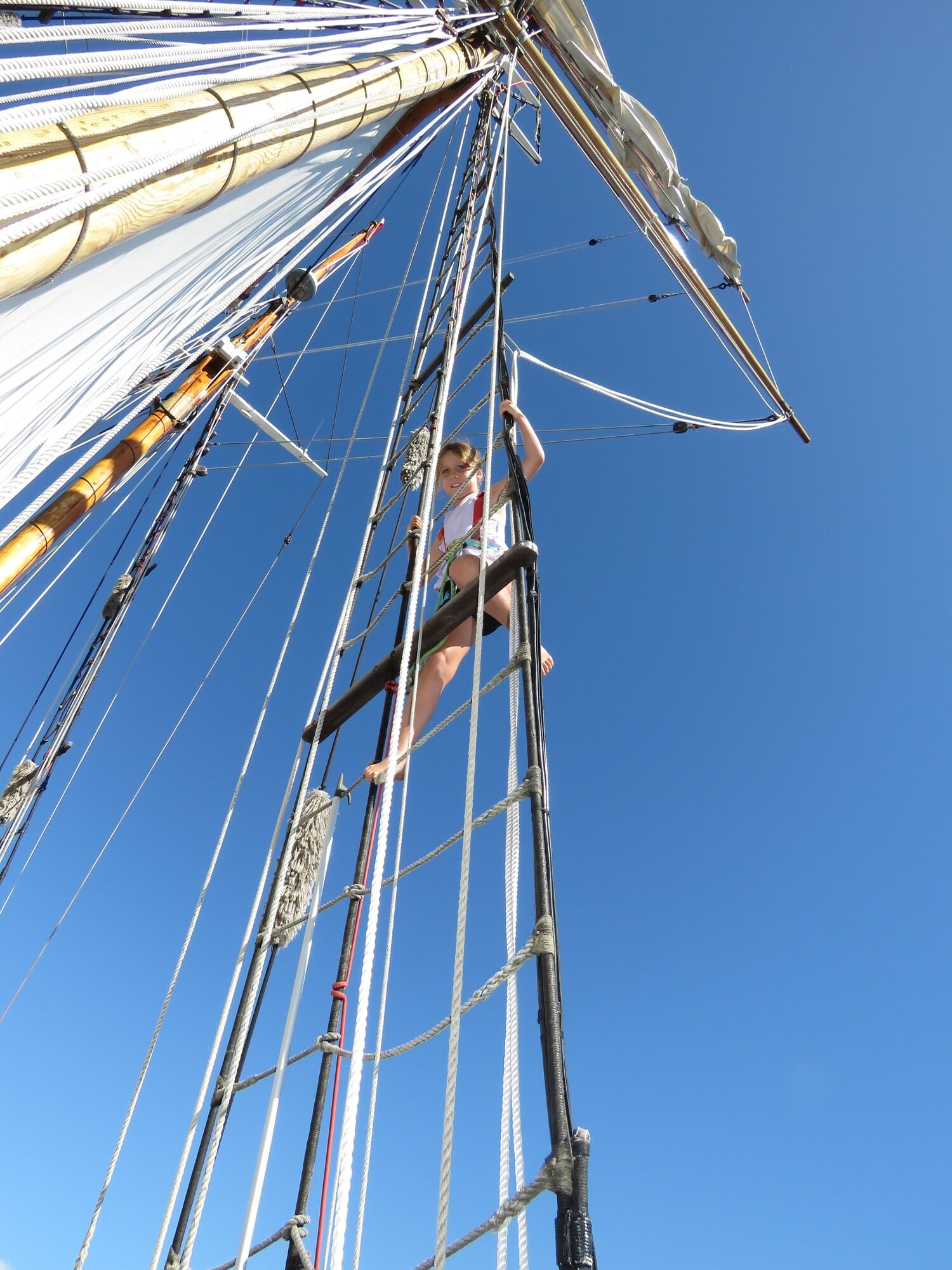  Eden Cave, 7, enjoys climbing the rigging aboard the R Tucker Thompson. Photo / Merle Cave