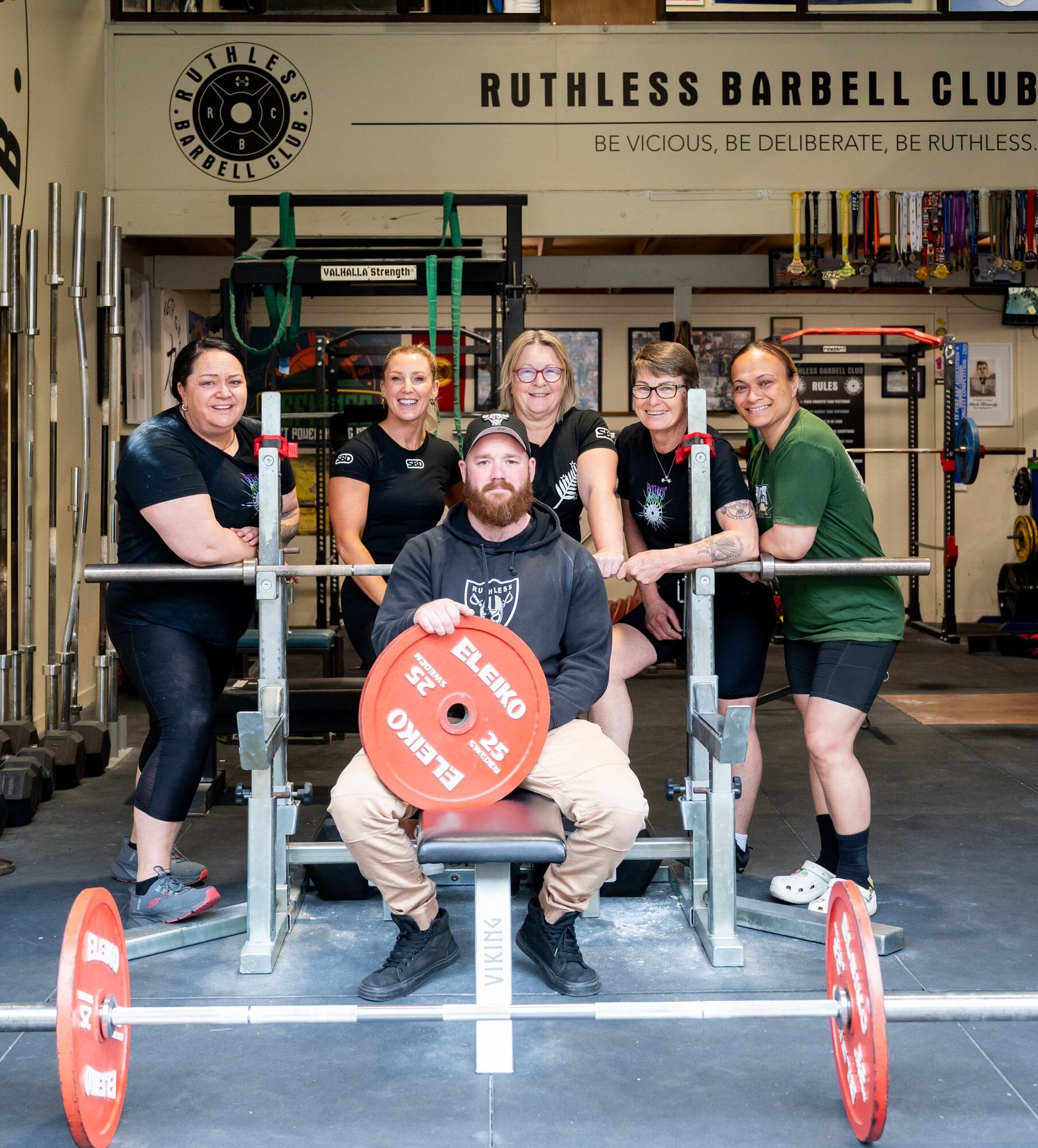 Judea powerlifters Kelly Egan, Stacey Handley, Delwyn Evans, Karen Humphreys and Sela Kingi, with their coach Mike Jones in front. Photo / Brydie Thompson