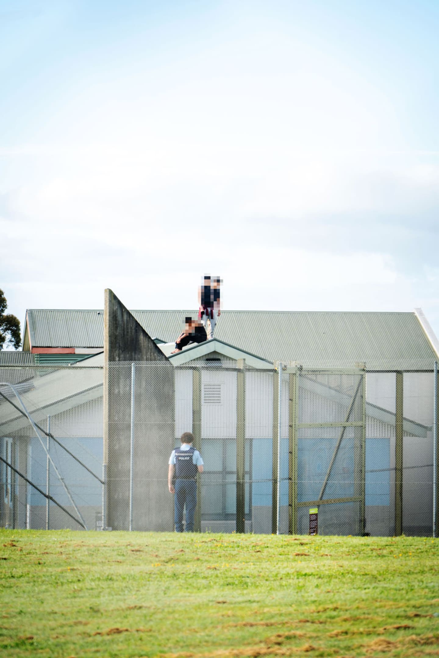 Police, along with youth justice facility staff, remain in negotiations with several youths after they gained access to the roof of its Wiri facility last night. Photo / Carson Bluck