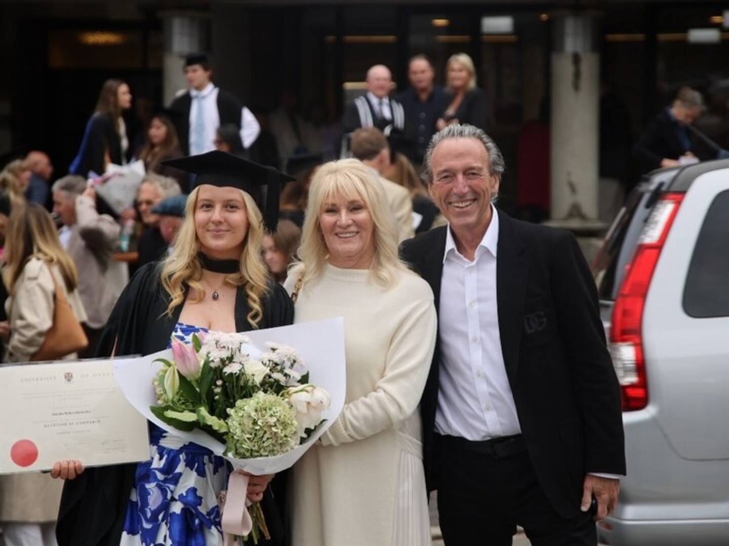 Jemima Hawkesby on graduation day with her grandparents, Robyn and Graeme Hart. Robyn says Flynn is much-loved and respected. Photo / Supplied