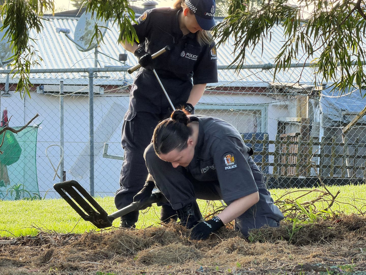 Police specialist search teams sift through Maybury Reserve in Glen Innes. Photo / New Zealand Police