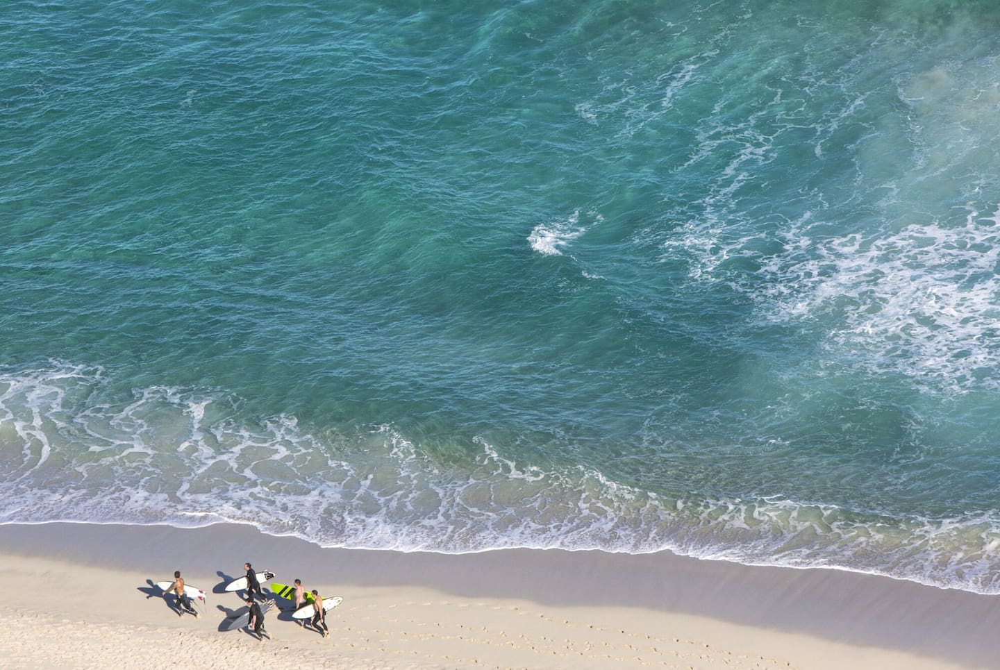 Surfers at Conto Spring Beach. Many Kiwis are chasing an active, romanticised Australian lifestyle. Photo / Tourism Western Australia