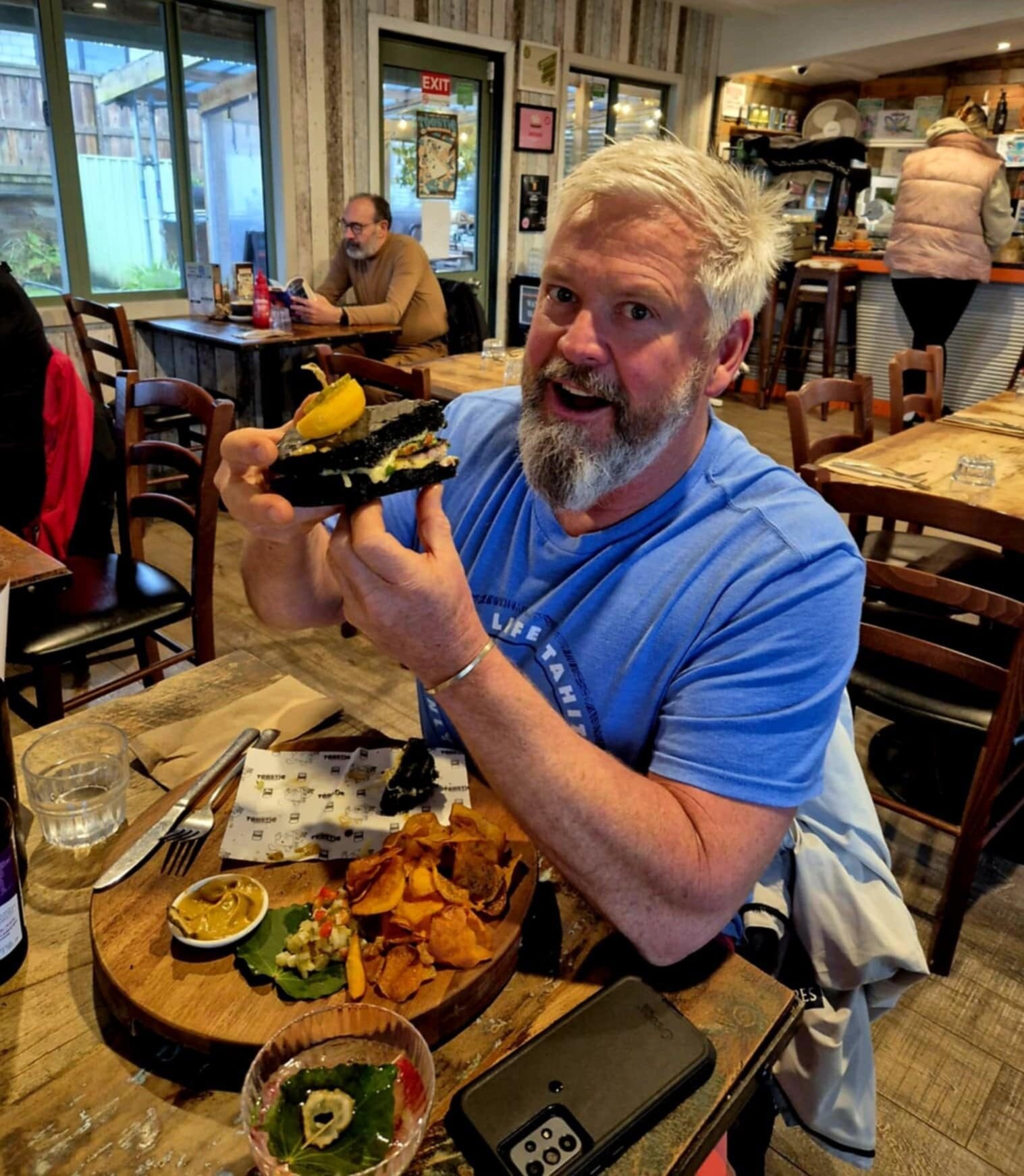 Gerrard Ellmers from G’s Cuisine enjoying a Taniwha Toastie. Photo / Supplied.