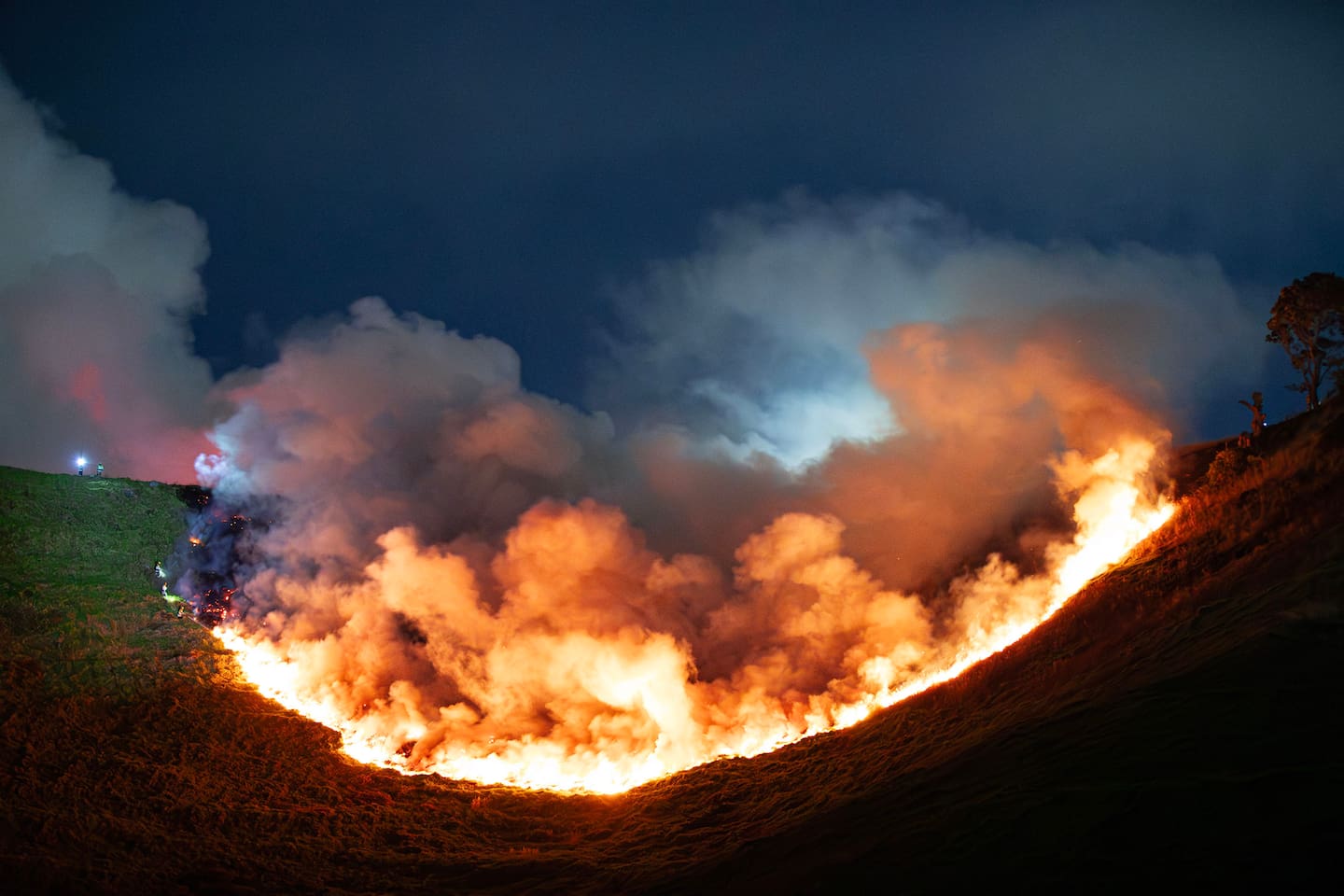 The scene on Māngere Mountain in South Auckland early this morning. A large fire occurred on the maunga overnight. Photo / Hayden Woodward